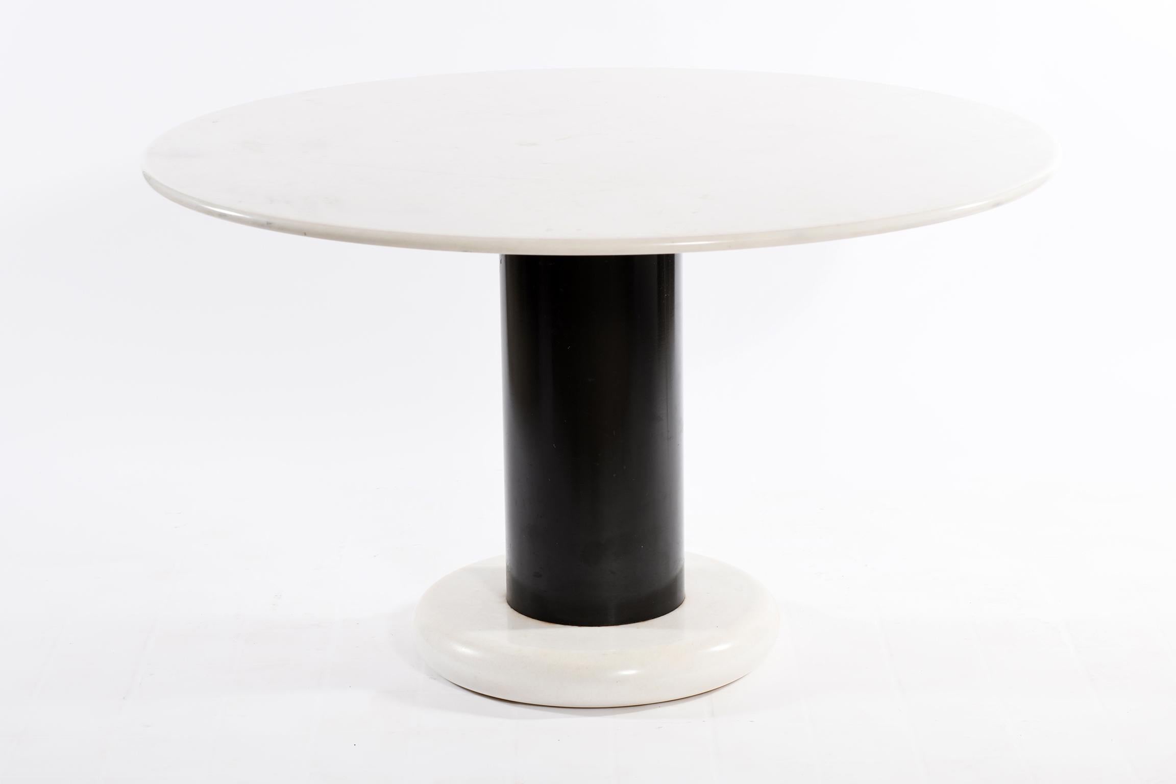 Ettore Sottsass for Poltronova Italy 1965, top and base in white marble and cylinder support in black lacquered iron, this icon of Italian design from the 1960s plays on the elegant contrast between the white of the marble and the black of the