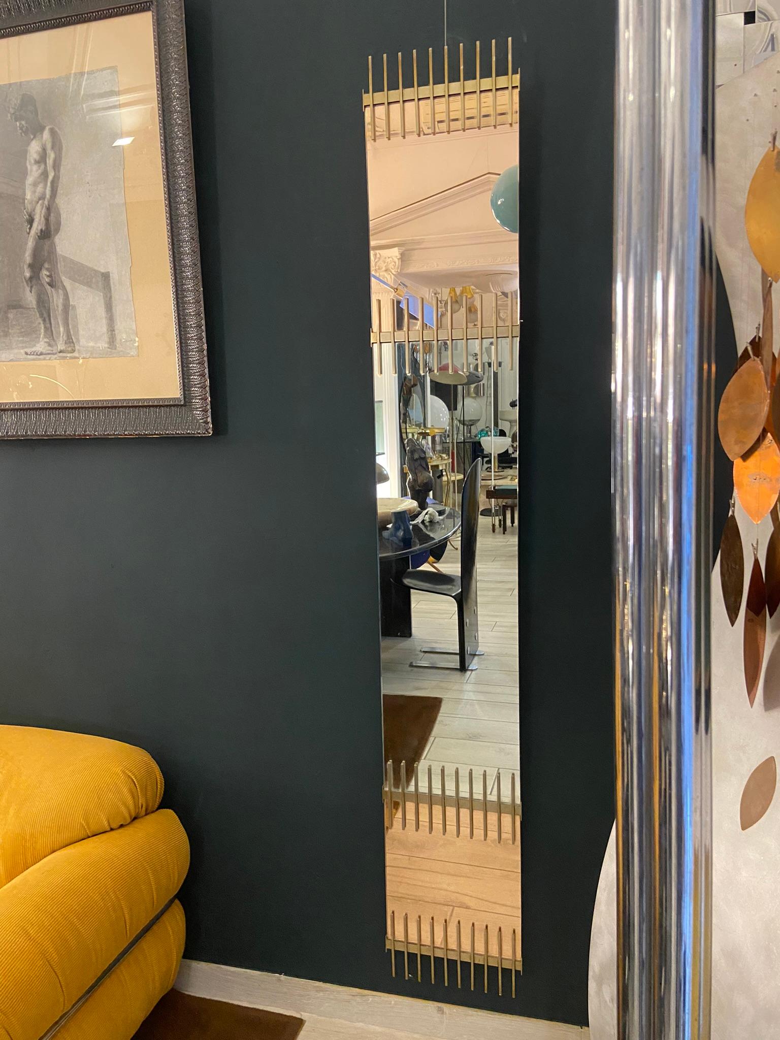 Very rare mirror by Ettore Sottsass, produced by Santambrogio and De Berti in the late 1950s. Pink and clear colored mirrored glass with brass top and bottom frames and black painted metal back frame.
This is the largest example of this series we