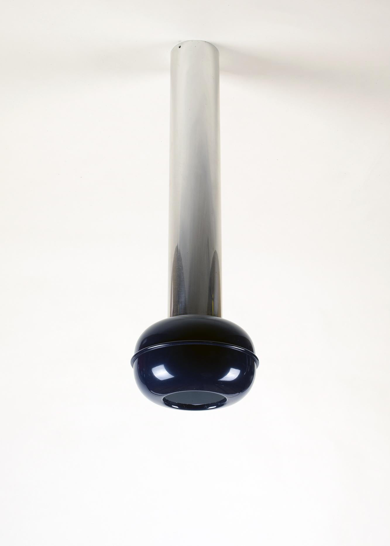 Ettore Sottsass, Austria/Italy (designer)
Stilnovo, Italy (manufacturer)
'Manifesto' ceiling lamp, designed 1970

Chrome-plated and blue lacquered metal shade with white interior. Original bulb holder and wiring. Original ceiling fixing plate