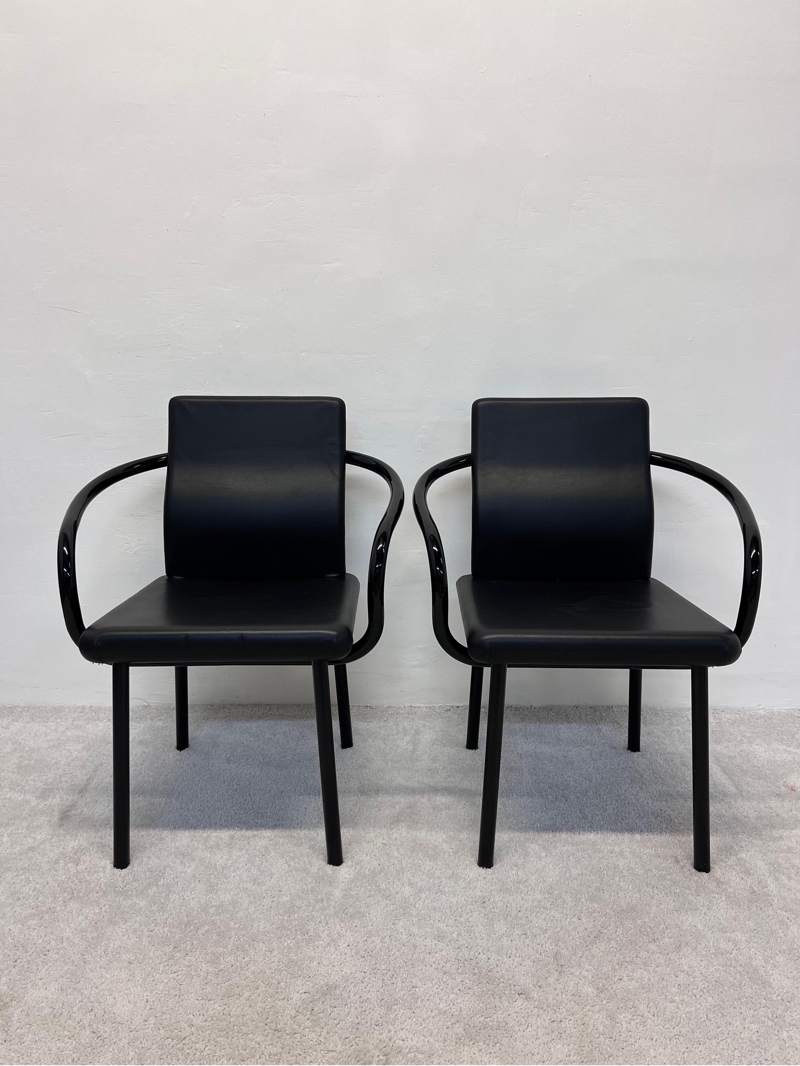 Memphis Postmodern Mandarin chairs rendered in black lacquered steel frame with black Naugahyde cushioned seats designed by Ettore Sottsass for Knoll.