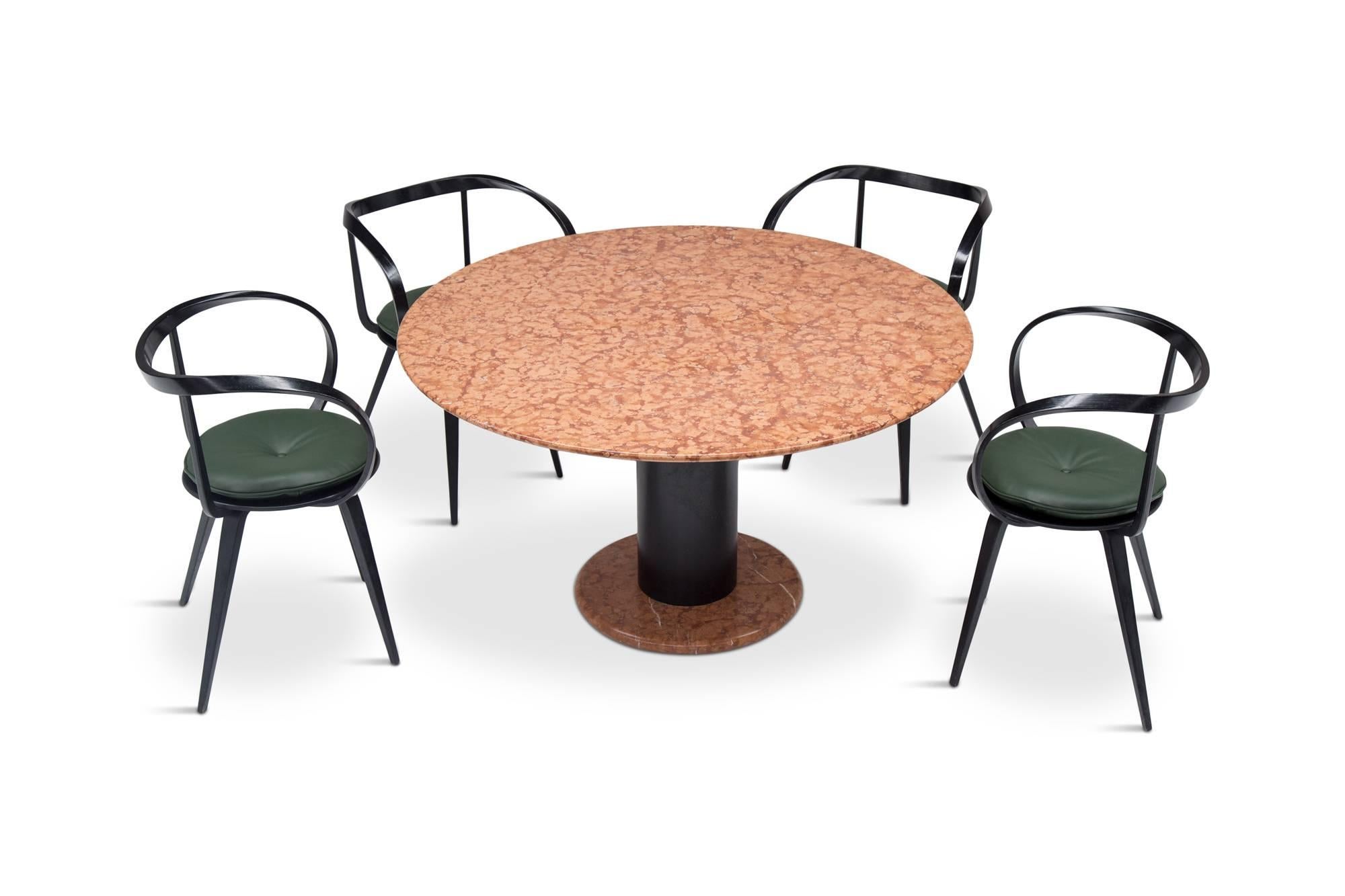 Postmodern memphis style table in marble by Ettore Sottsass for Poltronova, Italy, 1965. 

Round dining table by Italian master Ettore Sottsass. A black metal column with a round top, executed in beautiful rose marble.
 