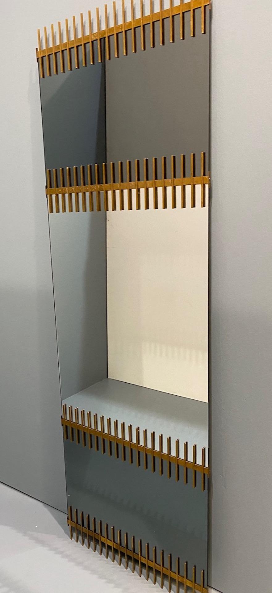 Rare mirror by Ettore Sottsass. From a small series produced by Santambrogio and De Berti in the late 1950s. Tinted and clear mirrored glass.
This is the largest example from this series that we have ever seen. Makers labels to back of glass