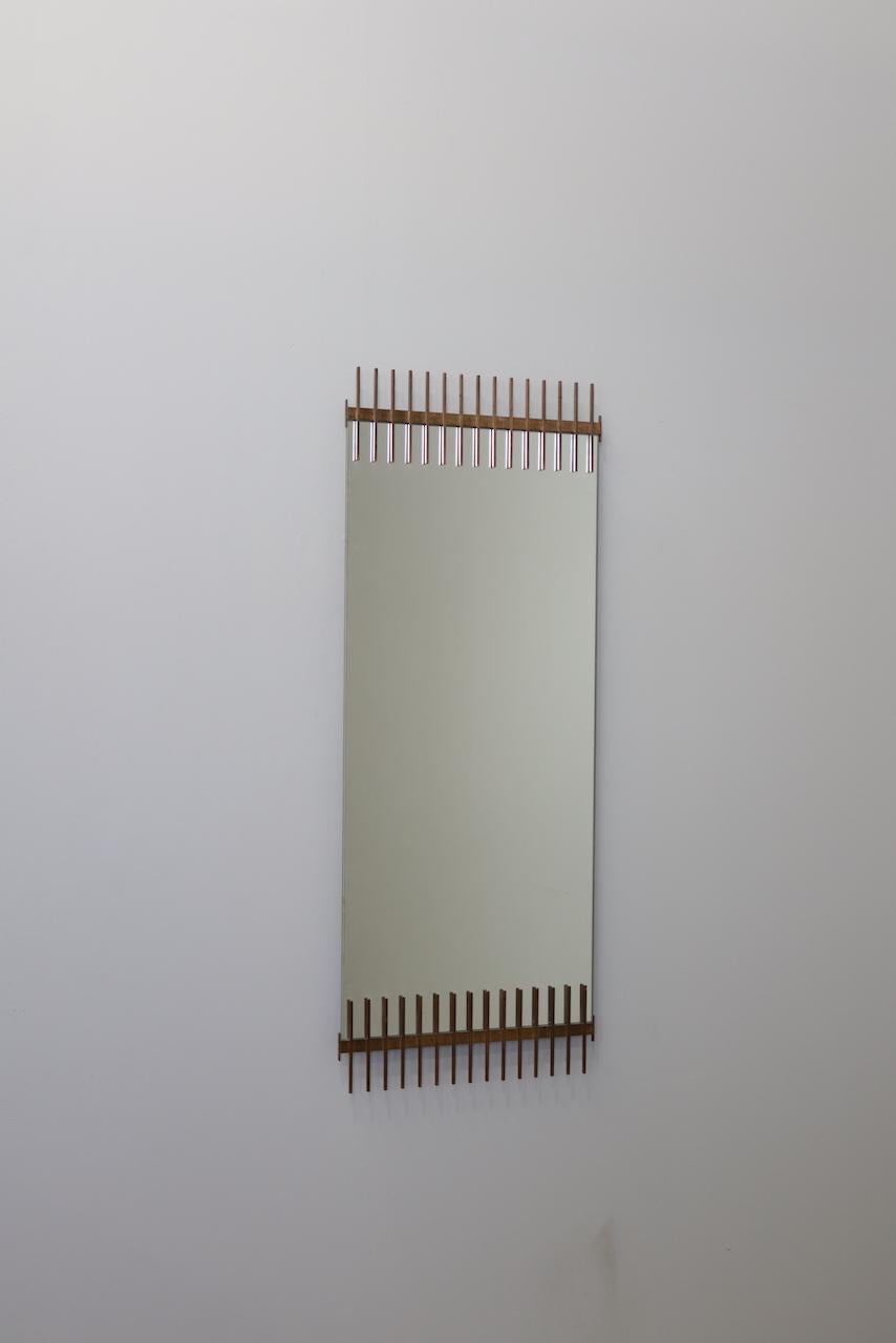 Rare mirror by Ettore Sottsass. From a small series produced by Santambrogio and De Berti in the late 1950s. Tinted and clear mirrored glass.
This is the largest example from this series that we have ever seen. Makers labels to back of glass panels.