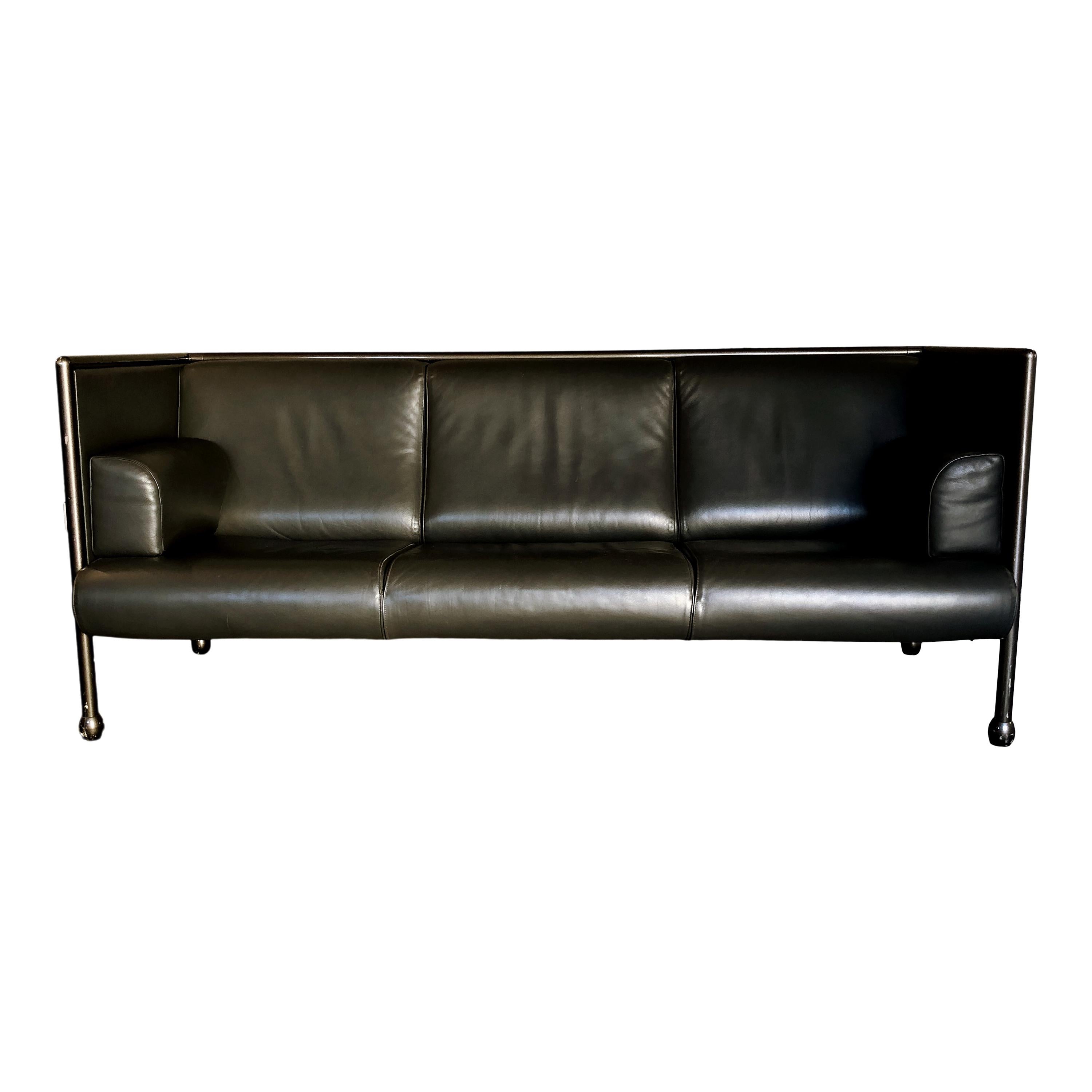 Danube sofa Model 850, three-seat, designed by Ettore Sottsass for Cassina. Iron structure covered with red cloth. Original black leather seat. Very good condition.

The 