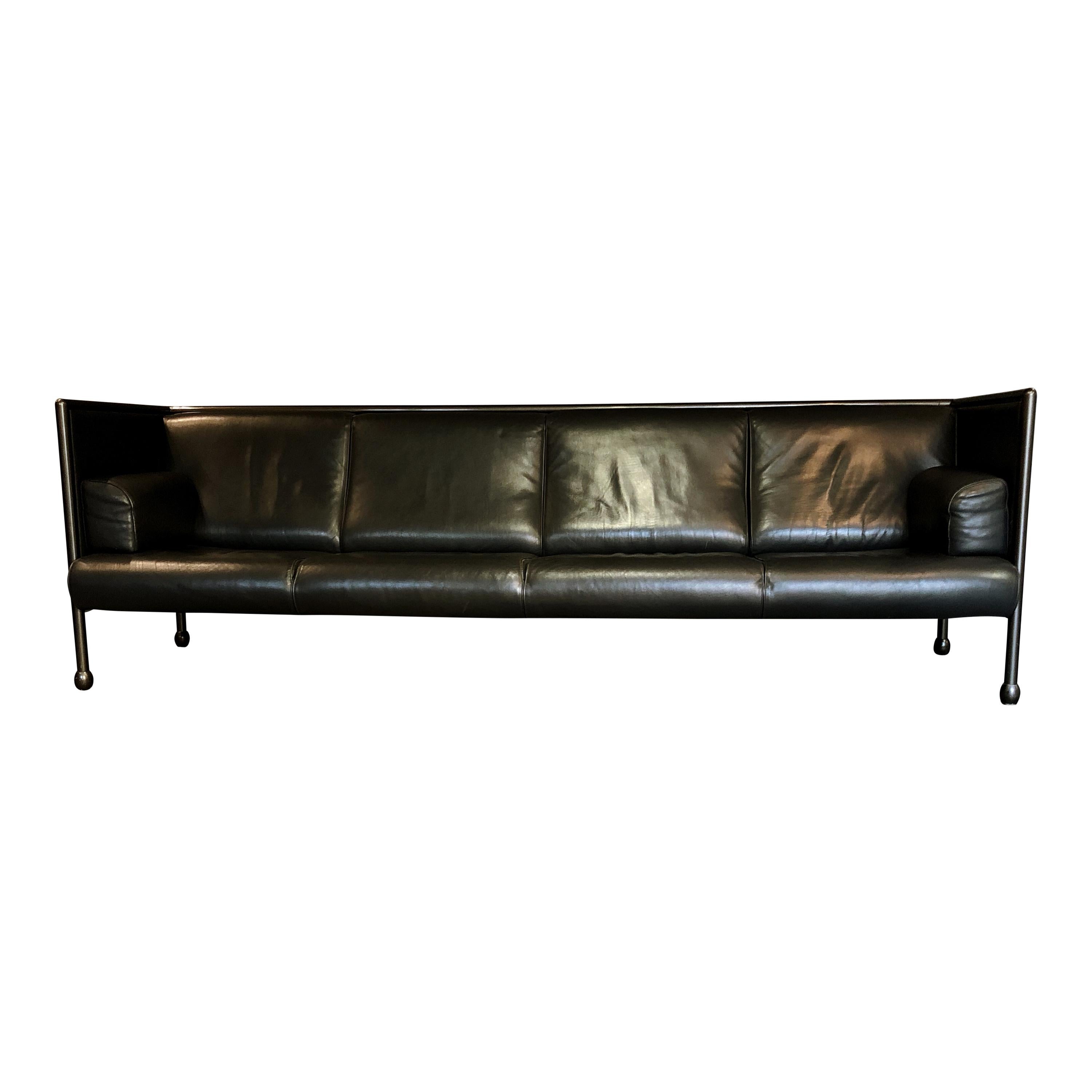 Danube sofa Model 850, four-seat, designed by Ettore Sottsass for Cassina. Iron structure covered with cream white cloth. Original black leather seat. Very good condition.

The 
