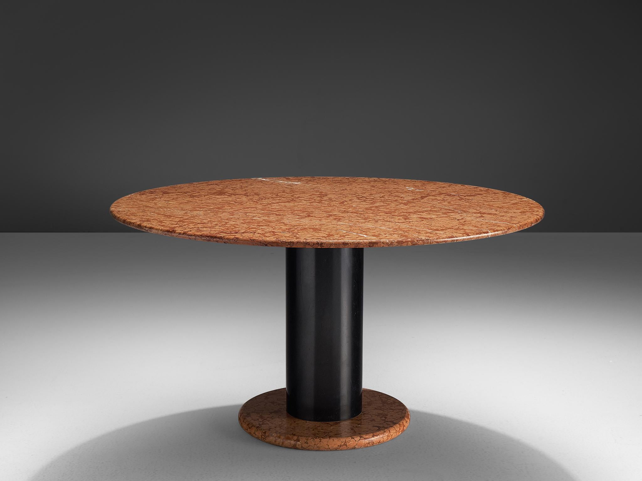 Ettore Sottsass for Poltronova, pedestal table, in red marble and metal, Italy, 1965. 

Round pedestal table by Italian designer Ettore Sottsass. A orange-pink round base with black metal cylindrical column. The round top is executed in beautiful