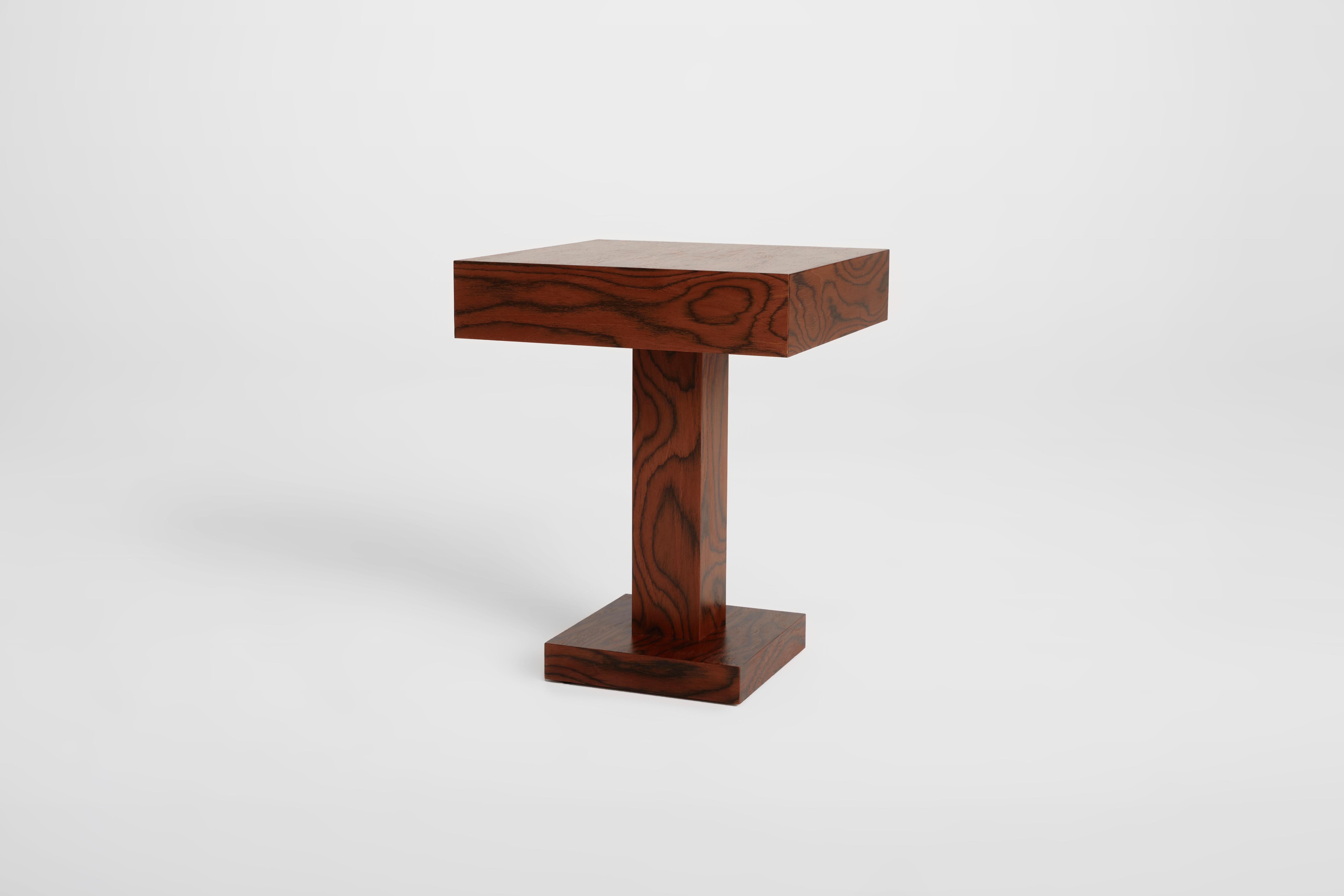 Introducing an unparalleled symbol of sophistication: the exquisite single side table crafted by Petra Madalena, adorned with a mesmerizing multilaminar wood veneer envisioned by the renowned creative genius, Ettore Sottsass.

The meticulously