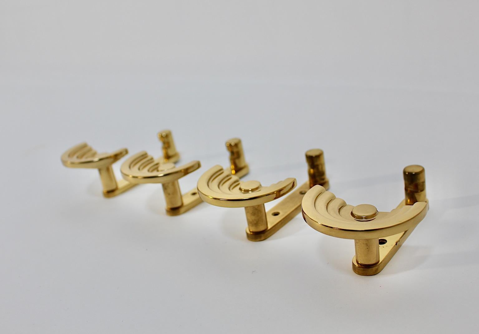 Ettore Sottsass vintage wall mounted hooks coat hooks from brass 
Valli & Valli circa 1985 Italy.
A wonderful poetic set of four ( 4 ) coat hooks from polished brass designed by Ettore Sottsass for Valli & Valli circa 1985 Italy.
These fabulous coat
