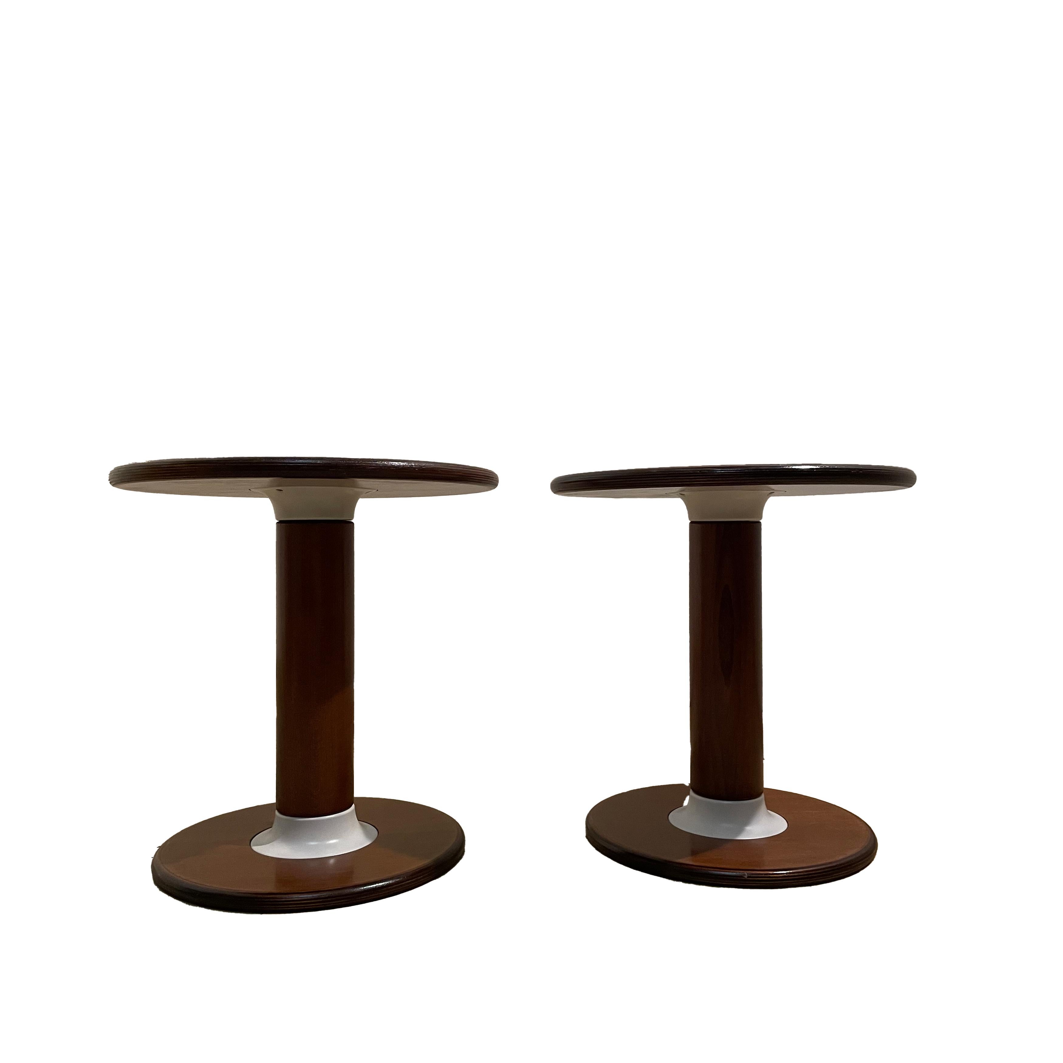 Pair of Rocchetto side tables, designed by Ettore Sottsass and manufactured by Poltronova in 1964.
Made of lacquered walnut wood.
Excellent vintage condition.

Ettore Sottsass Jr., a highly talented architect and designer, was born into a family of