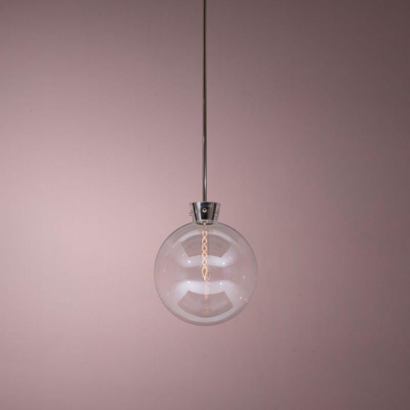 ETU pendant luminaire, polished nickel by Kaia
Dimensions: Glass Ø 35 cm
Stem Length 20/40/60 cm (can be customized) 
Materials: Polished Nickel

Also Available: Brass

All our lamps can be wired according to each country. If sold to the USA