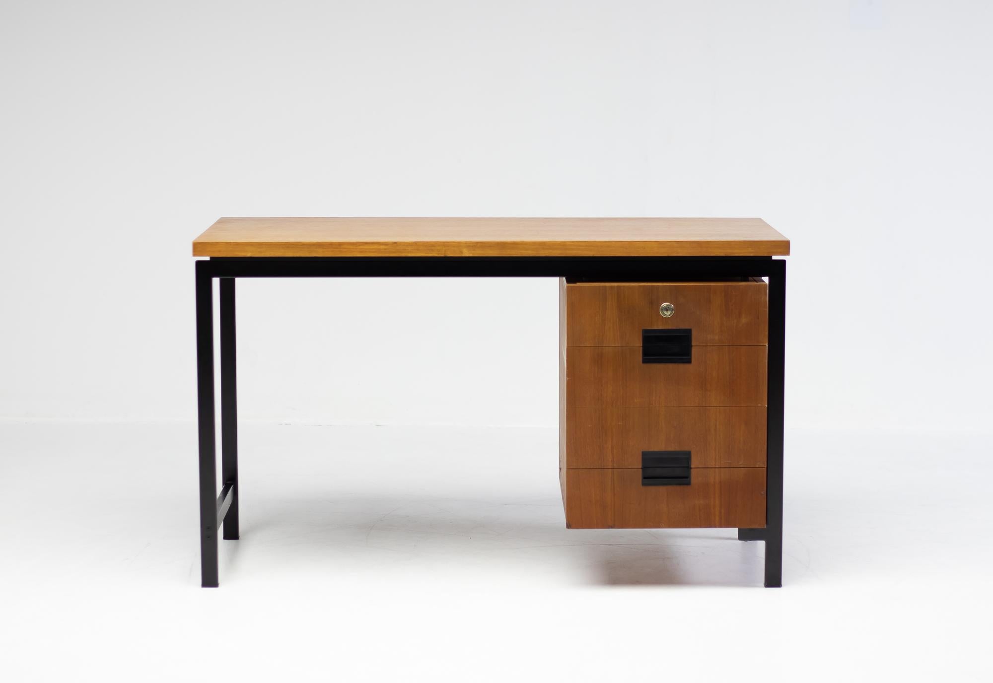 Elegant EU-01 desk from U+N series in teak, designed by Cees Braakman for Pastoe in 1958. 
Drawers with the renown teak bent plywood interior. 
The desk is marked with the Pastoe silver label.