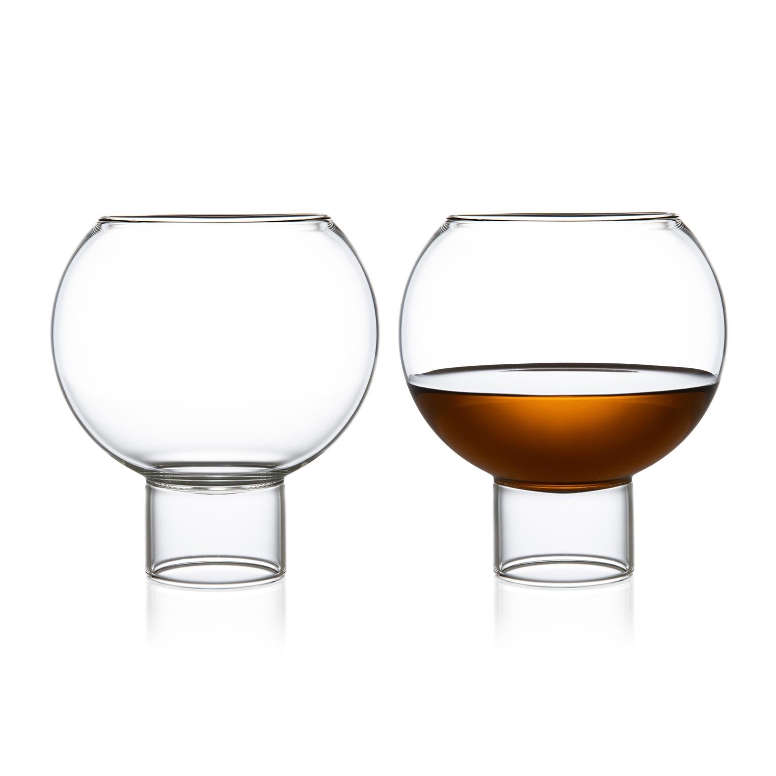 Tulip low medium, set of two.

This item is also available in the US.

The tulip collection was inspired by the small bistro wine glasses found in European bars and cafes. The bowl of the glass sits down into the cylindrical stem, highlighting