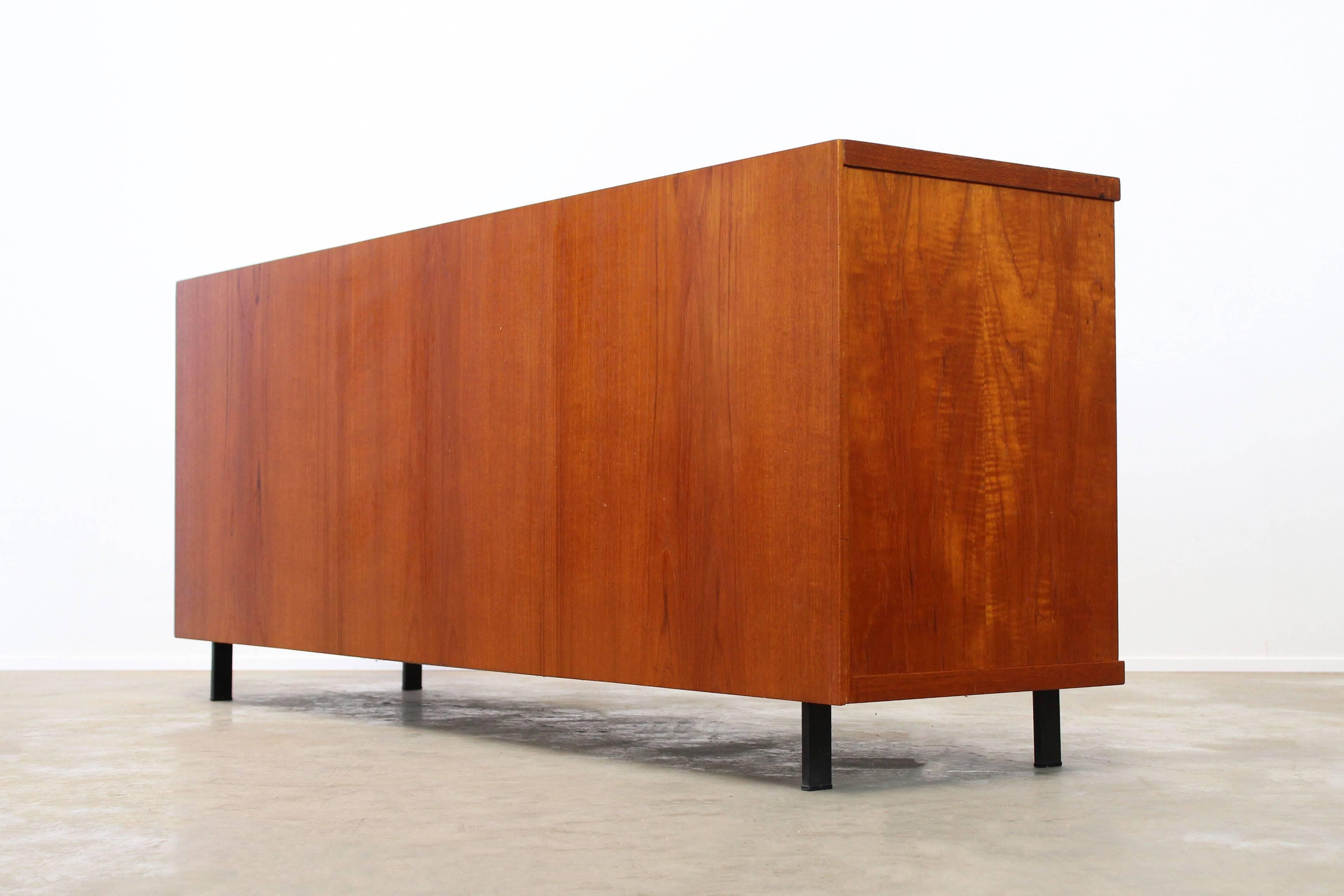 Cees Braakman EU04 Japanese series sideboard for UMS Pastoe, 1950s. This is one of the very few models that can be used completely freestanding , because the sideboard is covered in teak on all sides. However this made it more expensive to produce.