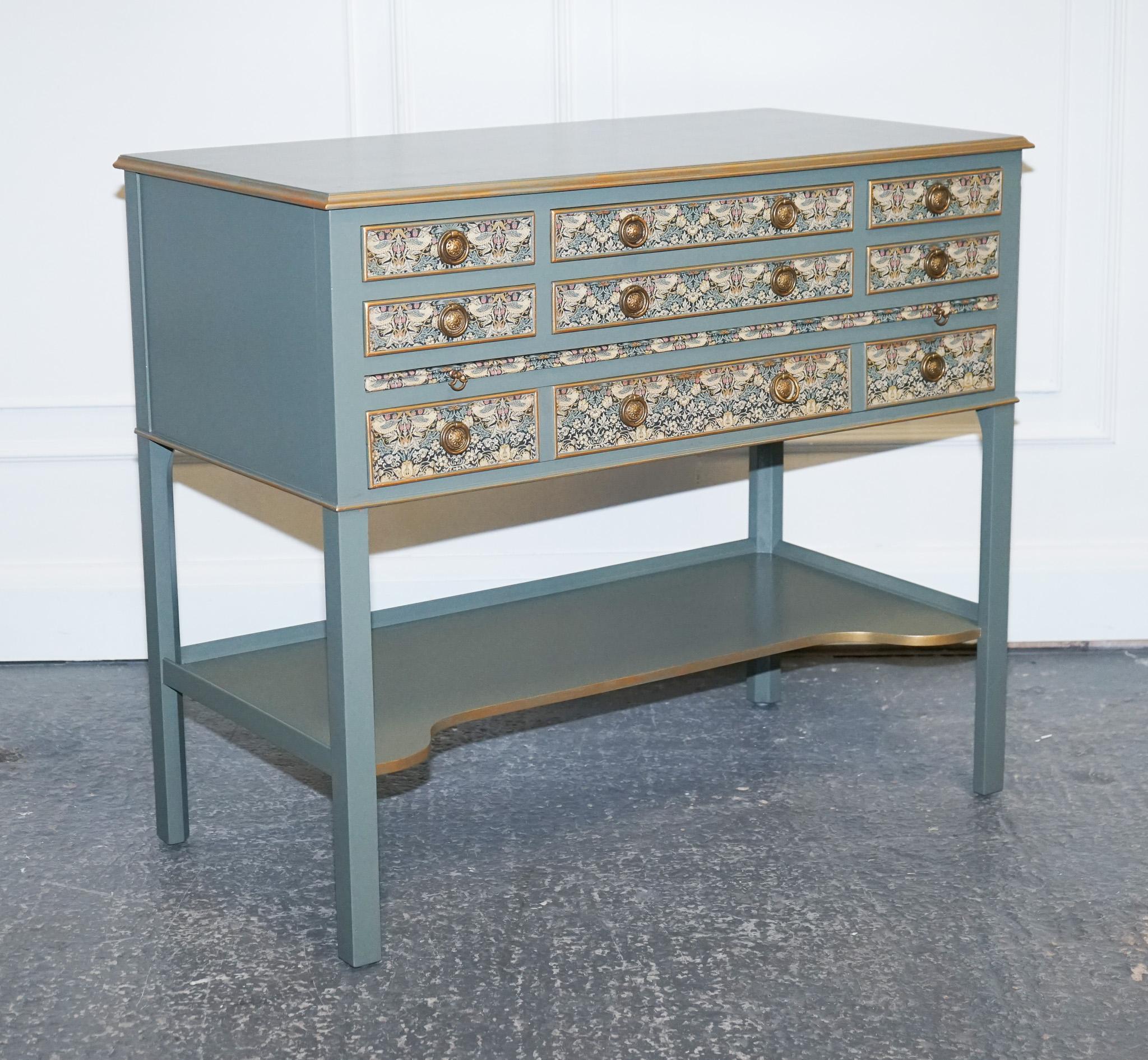 We are delighted to offer for sale this Gorgeous Eucalyptus Green & Gold Console Table With Strawberry Thief, William Morris Wallpaper.

This one-of-a-kind piece is sure to make a statement in your home, adding charm and sophistication to any room