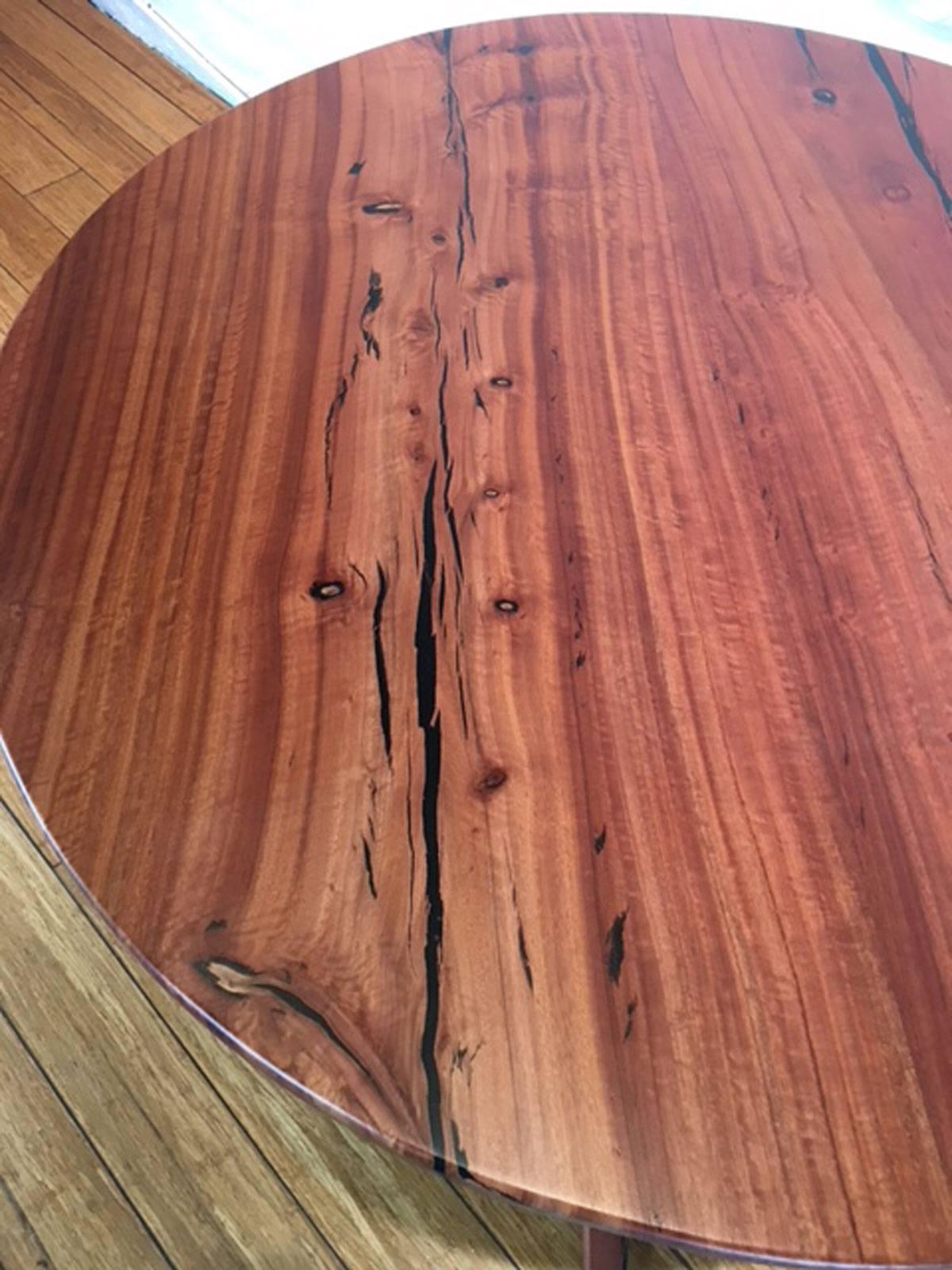 Eye-catching eucalyptus wood centre table designed and produced by master wood artist and designer Scott Mills who only uses reclaimed (deadfall or storm downed trees) in the pieces he produces. This piece is solid eucalyptus wood. No veneer.