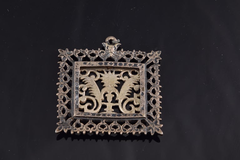 Venera reliquary or devotional Eucharistic medallion, 17th century.
 Rectangular devotional medallion composed of a band of plant elements and a central Eucharistic motif, in which you can see a chalice with a Sacred Form with the Cross wrapped in