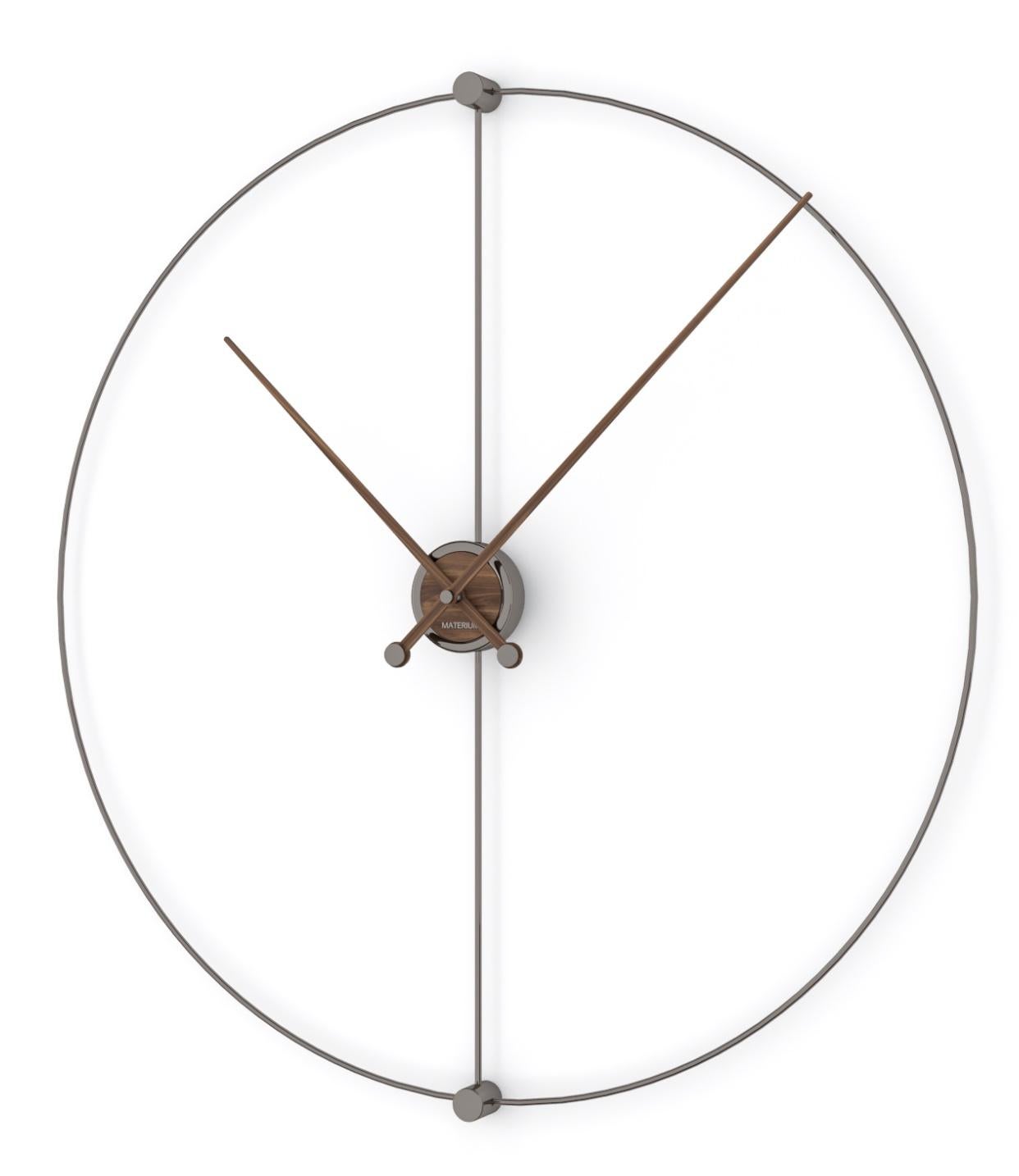 Metals and precious woods give life to a large clock inspired by the perfection of mathematics. The circumference of Euclidean, divided by its diameter, is emphasized by long and contrasting hands, as if to mark a geometric calculation.

All of