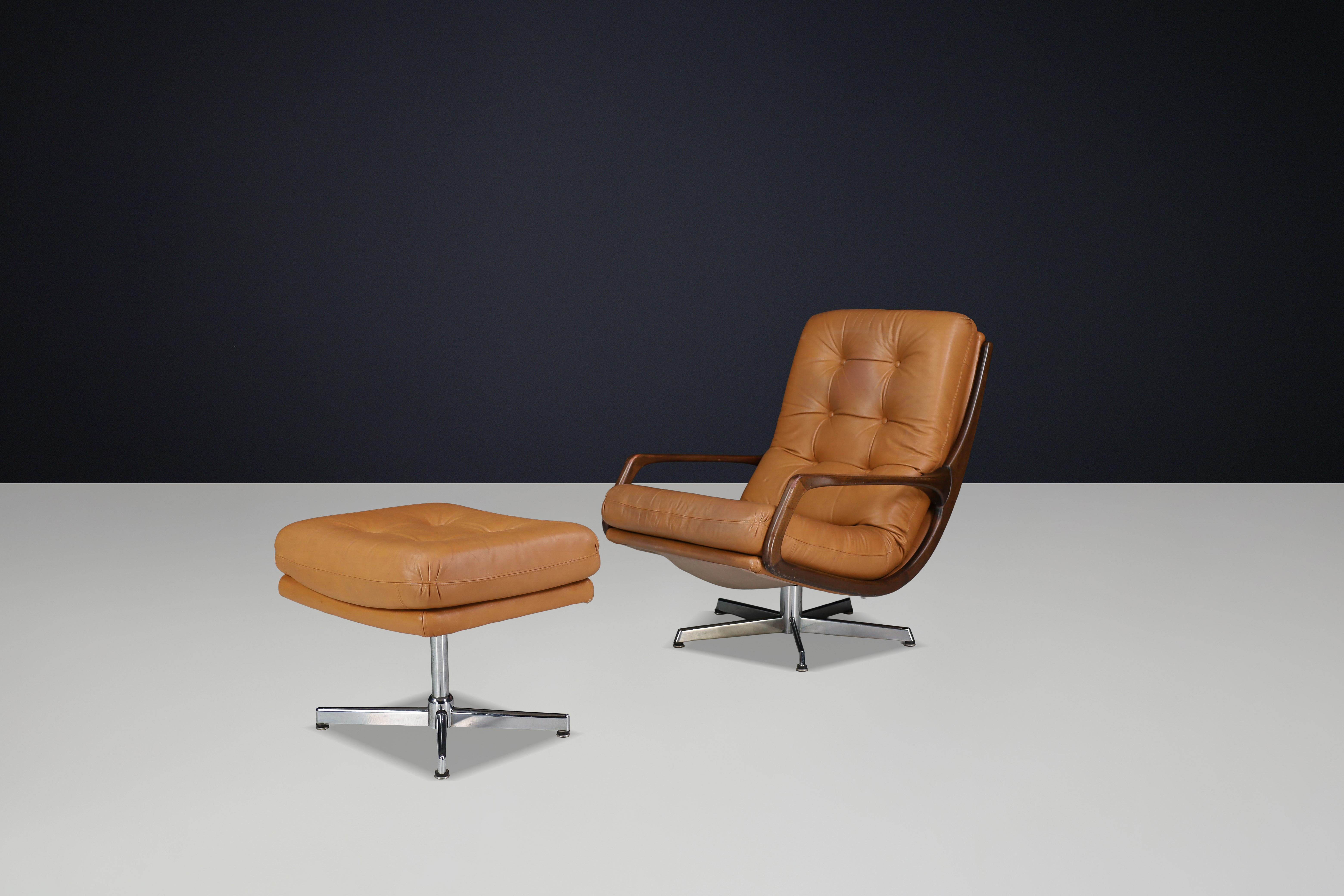 Eugen Schmidt Swivel Lounge Chair and Ottoman in Cognac Leather, Germany, 1970s

Designed by Eugen Schmidt in the 1970s, this iconic lounge chair and ottoman set is a masterclass in modern German craftsmanship. Combining sculptural elegance with
