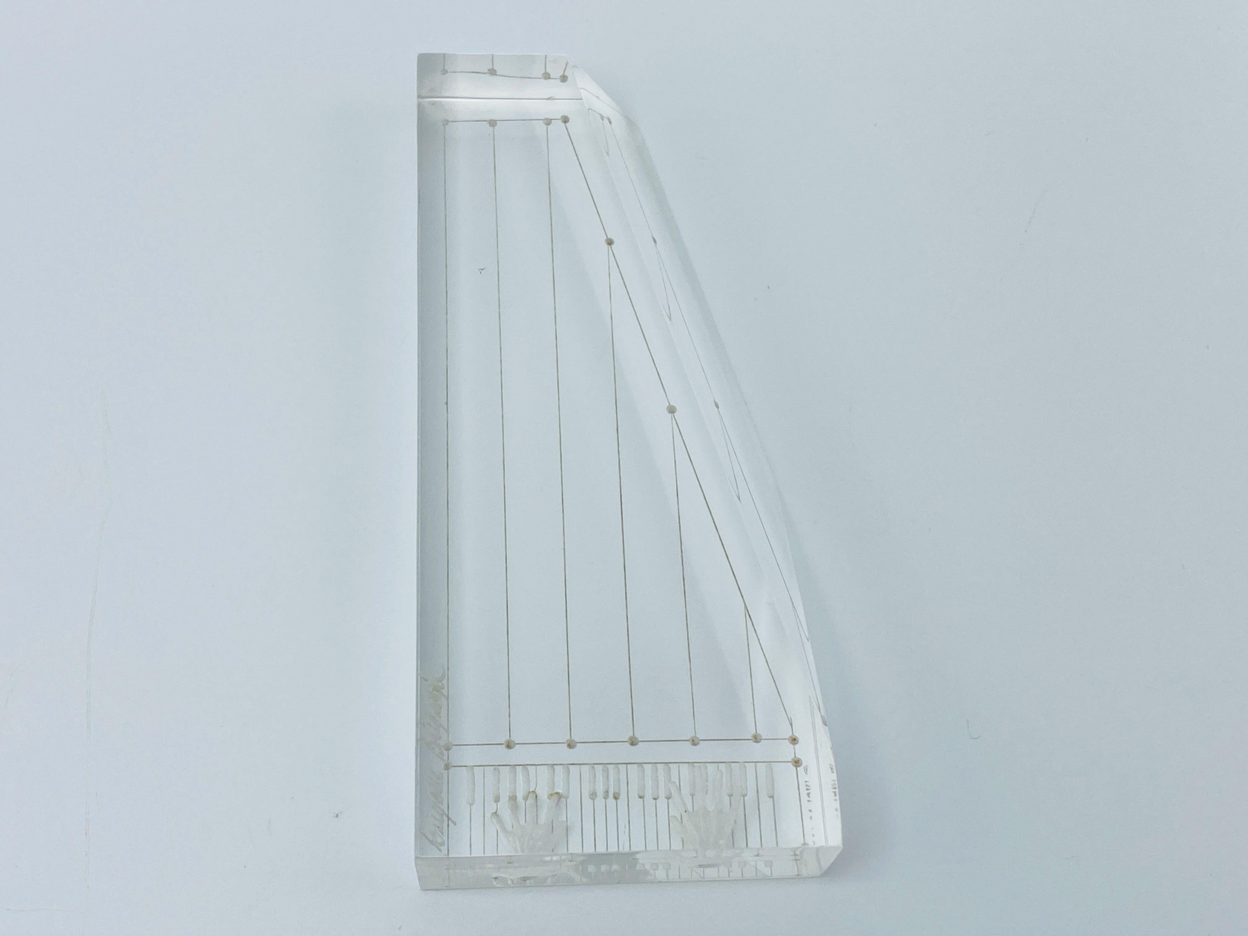 Listed is a fabulous and rare, Lucite piano sculpture by Eugene Brignola, circa 1980s. Exquisite detailing. No chips or gauges along edges. Signed by artist, see last photo. Weighs .5lbs.