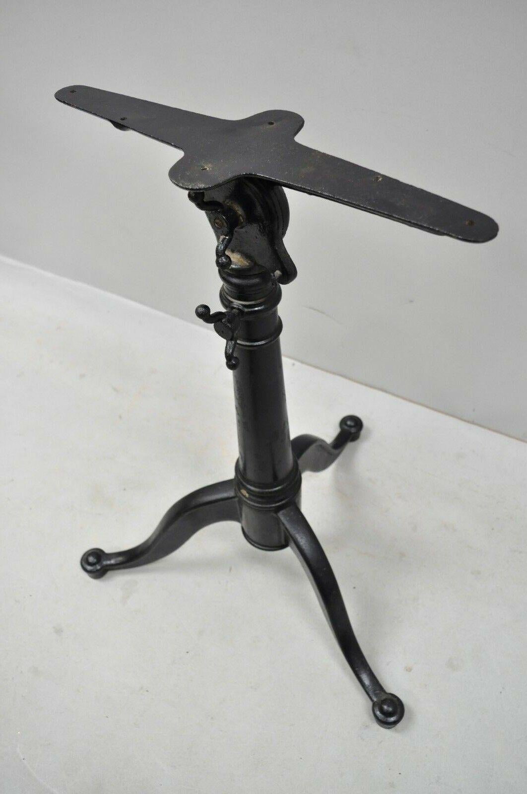 Eugene Dietzen cast iron small drafting work desk tripod base. Listing is for base only. Heavy cast iron construction, adjustable height and tilt head, circa early 20th century. Measurements: 28 - 41