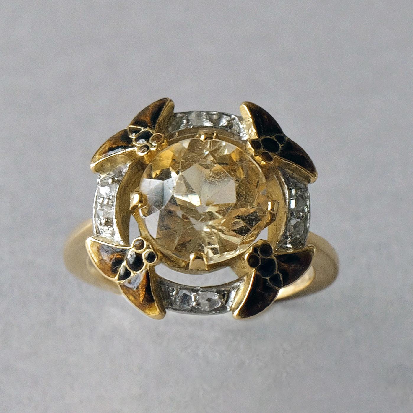 A beautiful and exceptionally rare topaz, diamond and enamel ring, signed Feuillatre. Designed with a four claw set round yellow topaz, within a hoop surround with brown enamelled insects to the quarters & twin set rose-cut diamonds between the
