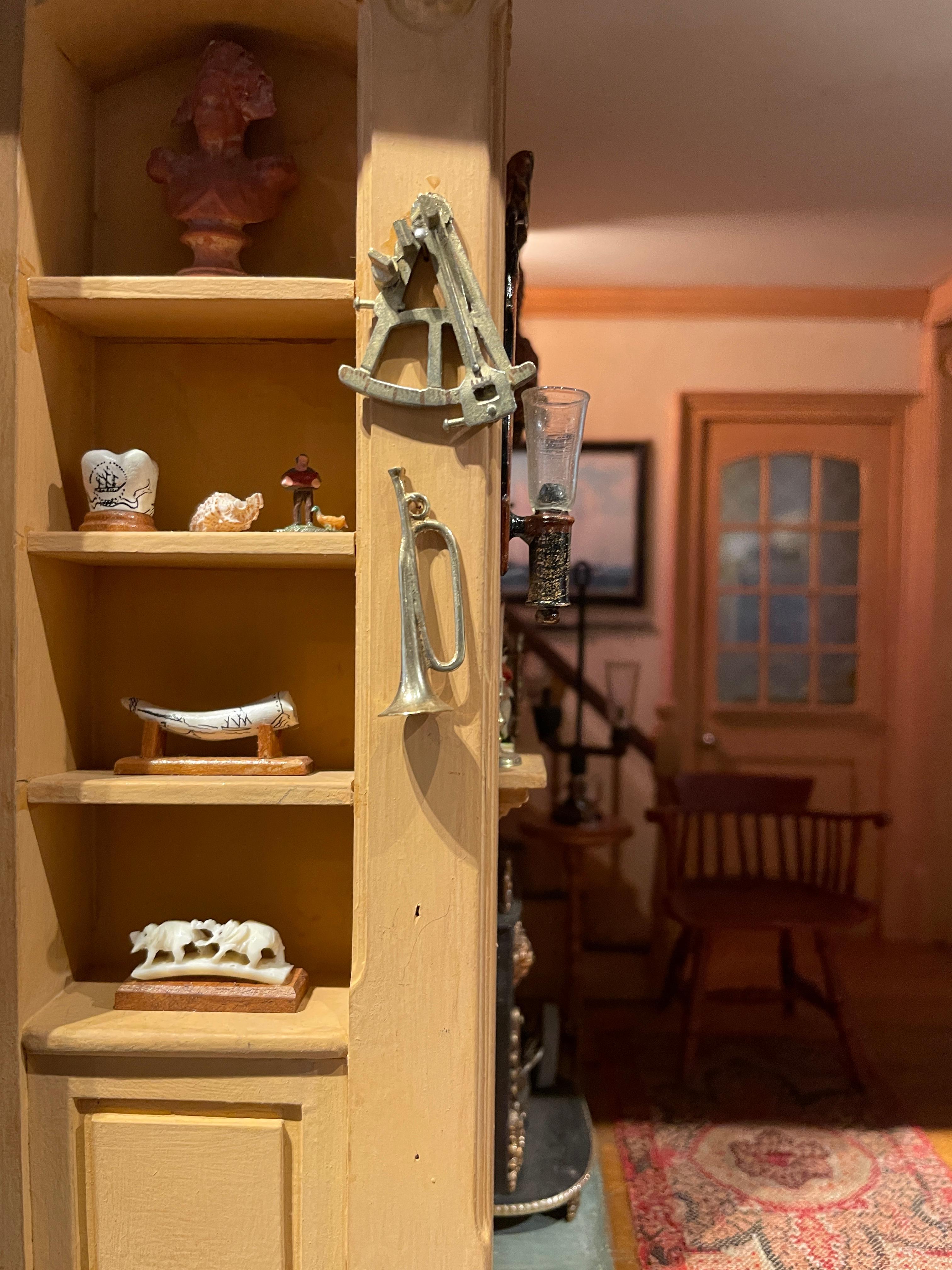 This highly detailed Miniature Room of a Retired Whaling Captain's Study in Nantucket is an excellent example of the true talent of Eugene Kupjack. Tiny scrimshaw and knick-knacks fill the shelves while the perfectly proportioned furniture adorns