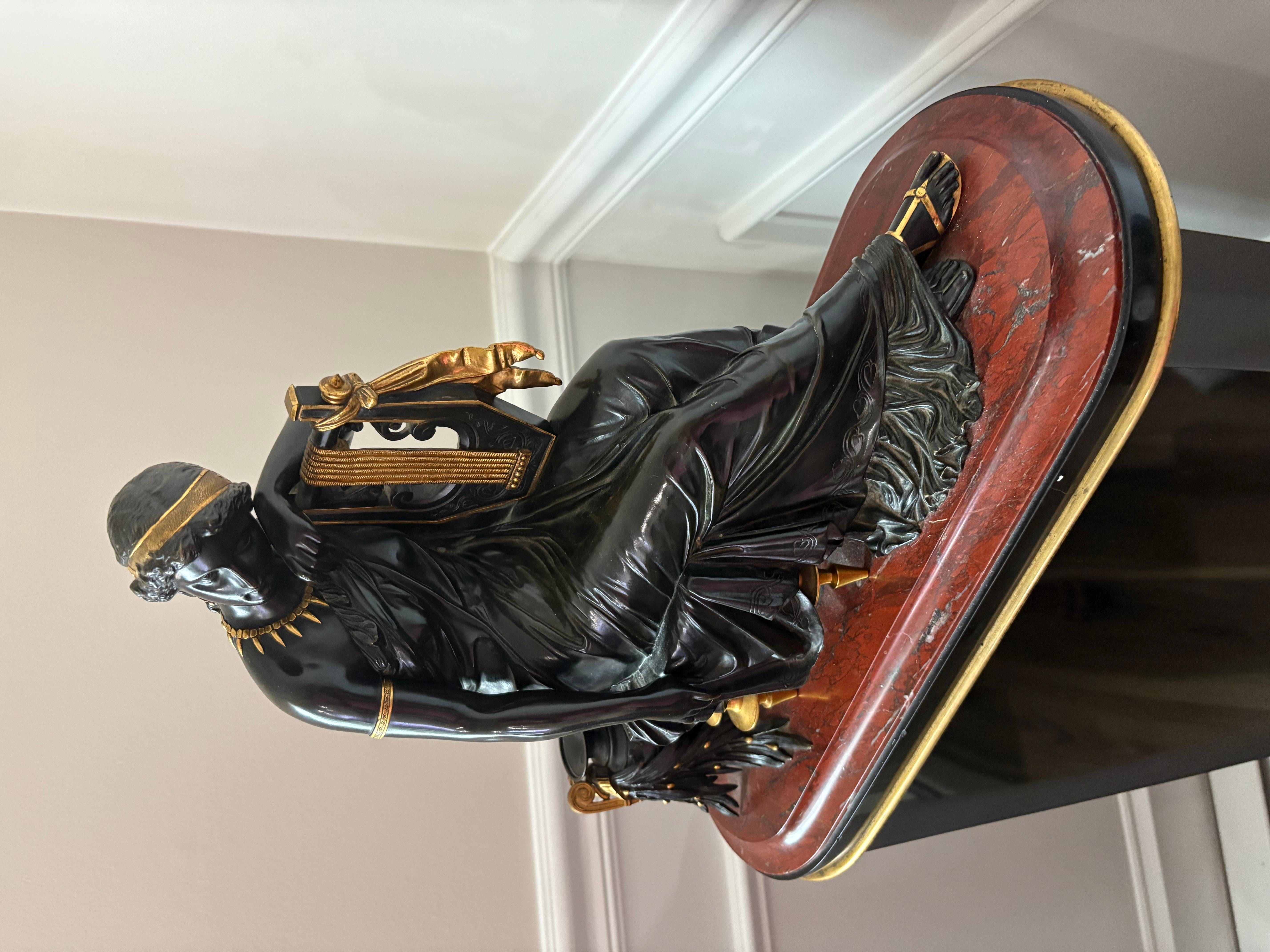 Eugene Laurent  (1832-1898) original signed bronze of Erato holding Lyre  gilded gold  Red & black   marble base
14 x 18 x7
great condition for its age 
very heavy bronze