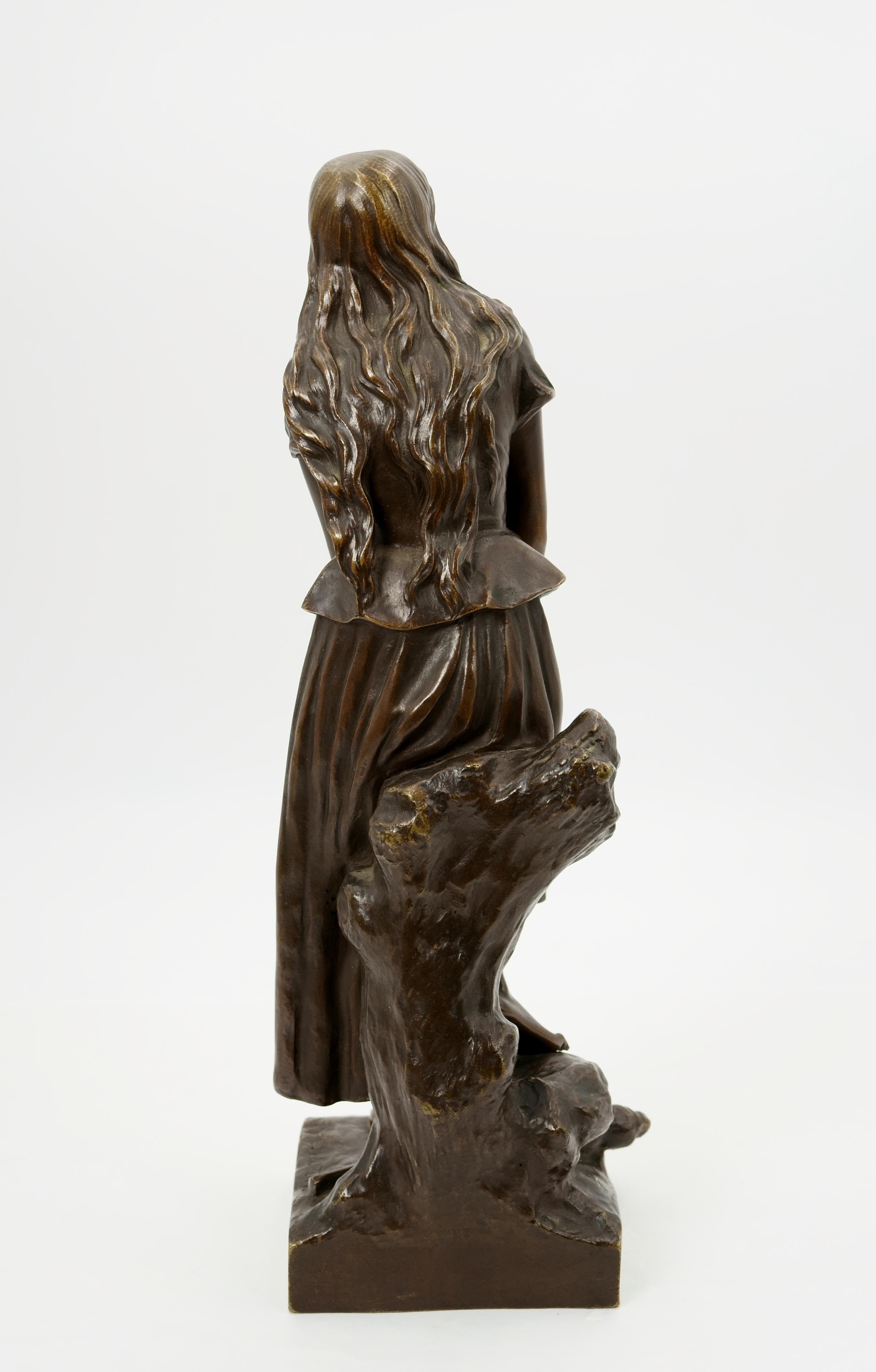 Eugène Laurent (1832 Gray - 1898 Paris), Joan of Arc, around 1880. Brown patinated bronze on a cast rectangular plinth with tree trunk and distaff. 40 cm (height) x 15.5 cm (length) x 15.5 cm (depth), weight 6.1 kg. Signed “E.[ugène] Laurent.” on