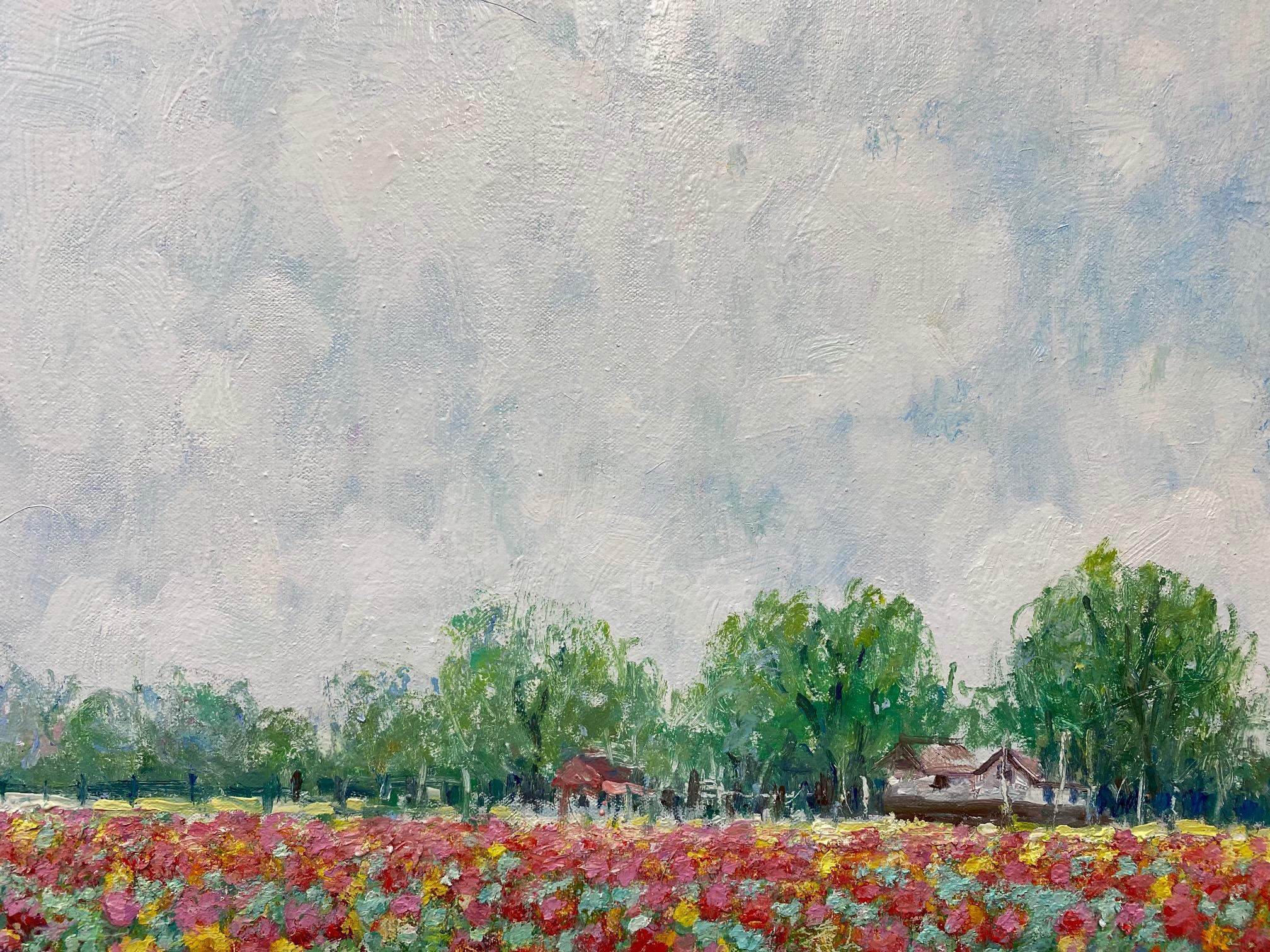 Lush and dreamy acres of seemingly unending tulips in a mosaic of pink, red, orange and yellow are being watched over by equally infinite white cotton candy clouds.  These tulips from heaven are presented as a contemporary expressionist floral