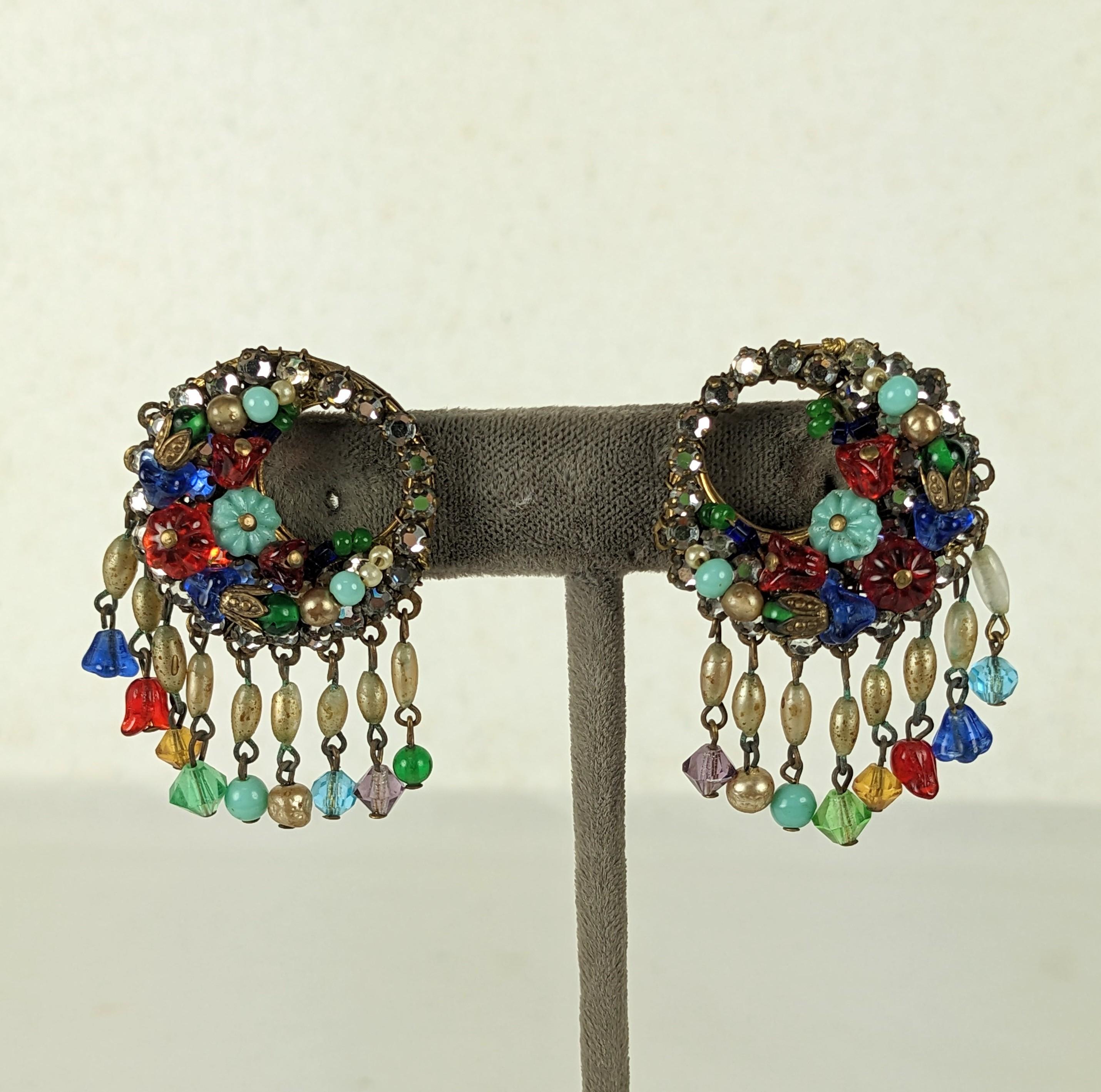 Charming Eugene Pave and Pate de Verre Flower Earrings from the 1940's. Hand sewn crystals with tiny glass flowers and faux pearls. Clip back fittings. 1940's USA. 
1