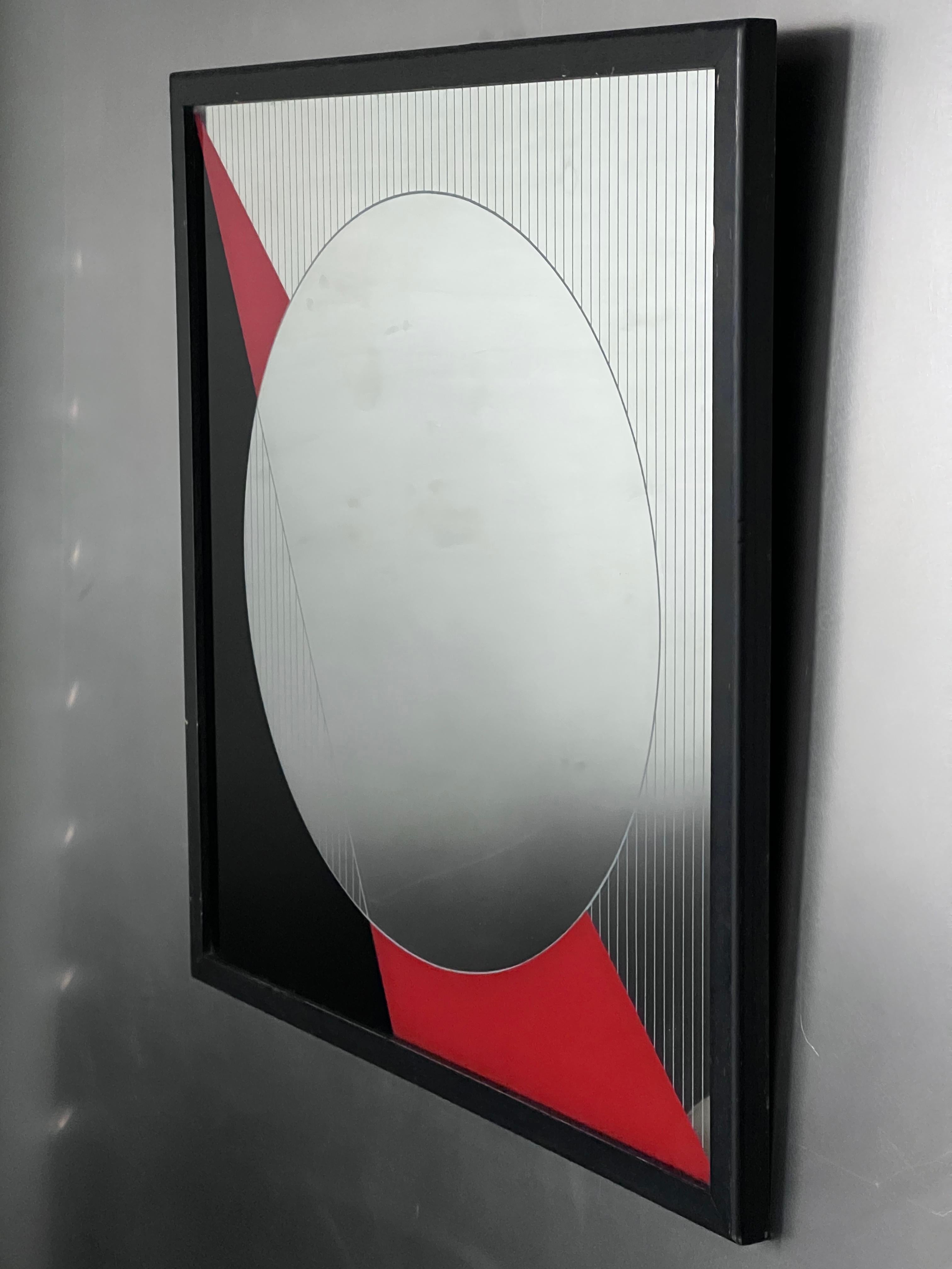Decorative geometric wall mirror by Italian artist Eugenio Carmi for furniture brand Acerbis. Designed in the 1980s and named 