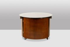 Eugenio Gerli, for Tecno. Round coffee table with built-in bar. Circa 1960.