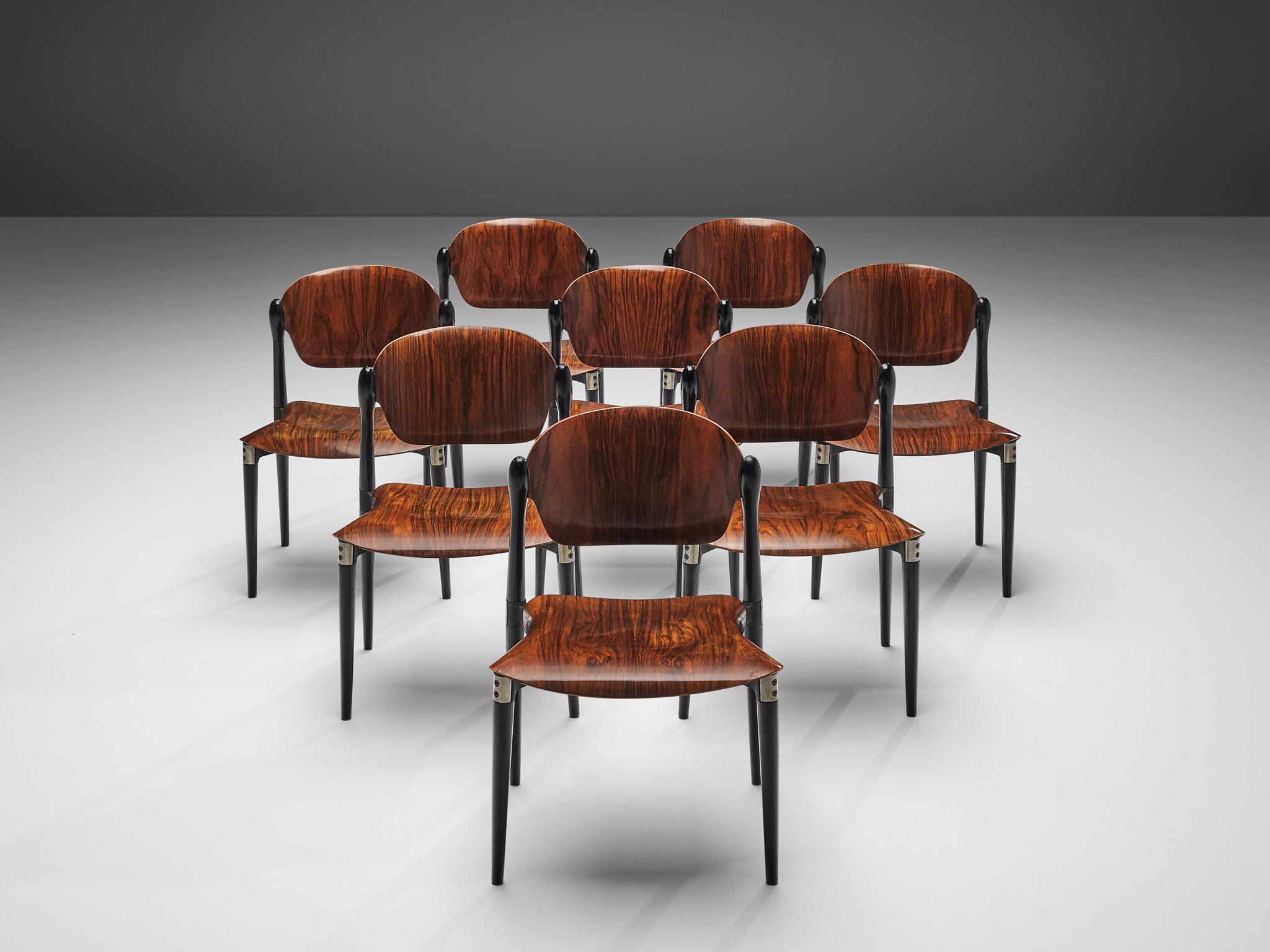 Eugenio Gerli for Tecno, set of eight dining chairs, rosewood, black lacquered wood, aluminum, Italy, 1962

Set of eight dining chairs by Italian manufacturer Tecno. The dynamically bent plywood seats and backs of these dining chairs are highlighted