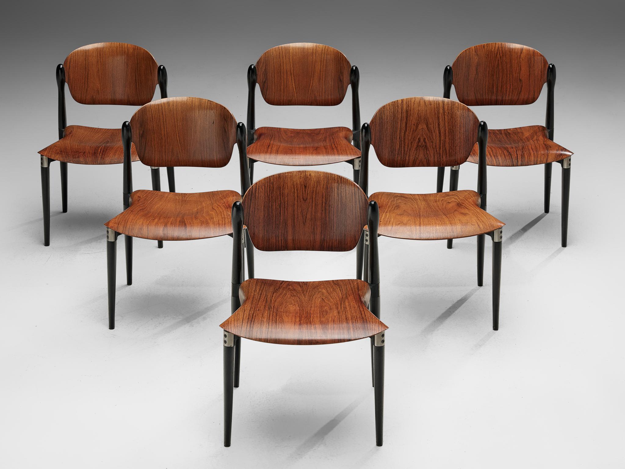 Set of six chairs, in walnut and oak by Eugenio Gerli for Tecno, Italy, 1962. 

Six dining chairs by Italian manufacturer Tecno. These chairs have a beautiful and interesting design. These stackable chairs have a Industrial appearance, yet at the