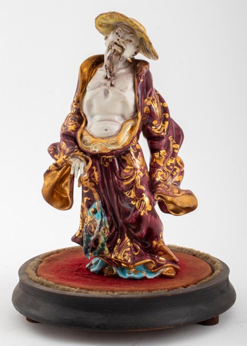 Eugenio Pattarino (Italian, 1885-1971) glazed ceramic pottery terracotta sculpture depicting a standing male figure wearing flowing robes and a hat, with gilt details, signed 