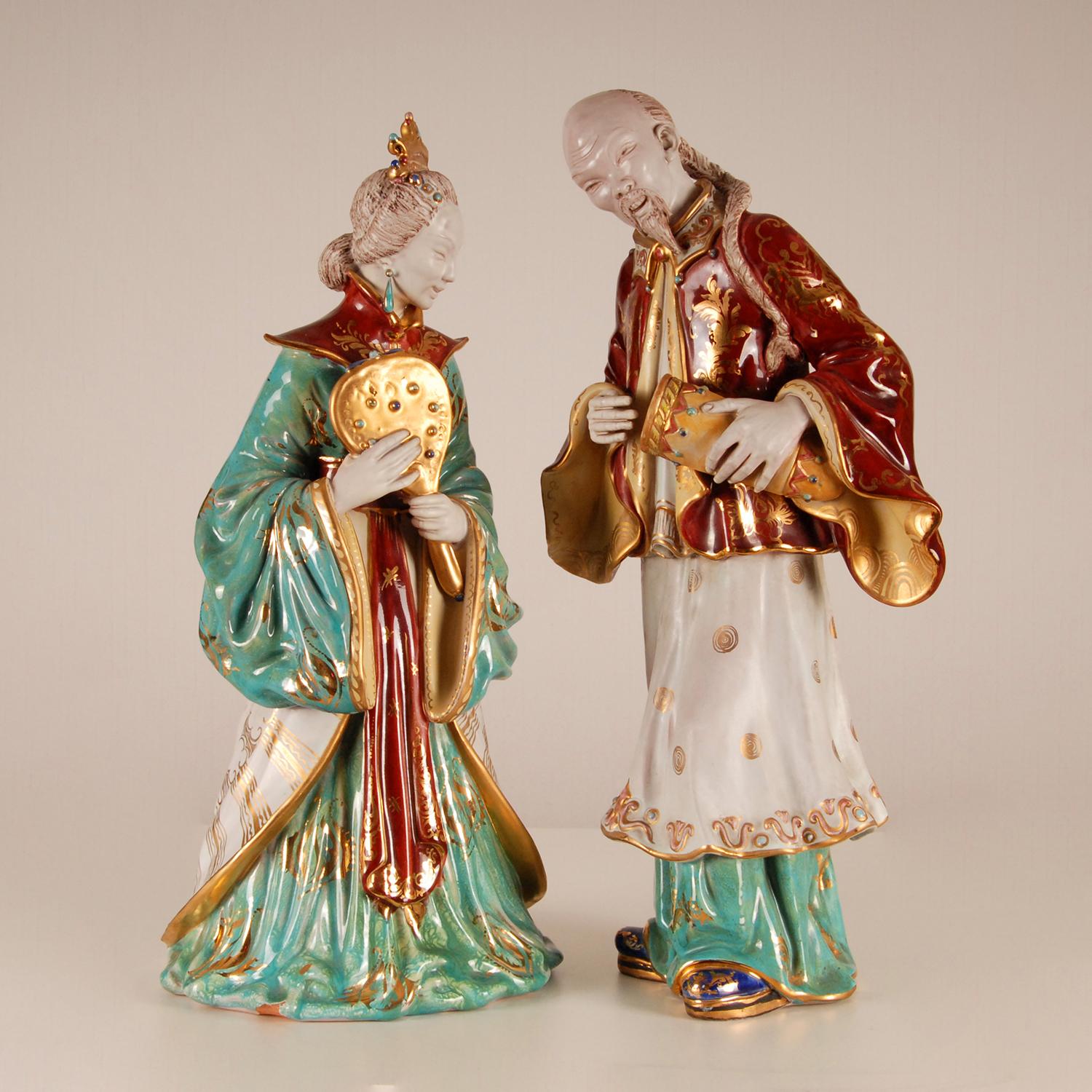 Eugenio Patterino Italian Sculptures Chinoiserie 
Italian glazed Terracotta figurines
Composed a Chinoiserie man and woman in a Chinese 1950s outfit
Made Of tin glazed earthenware / terracotta
Very colourful and heighten with gold
Made by Eugenio