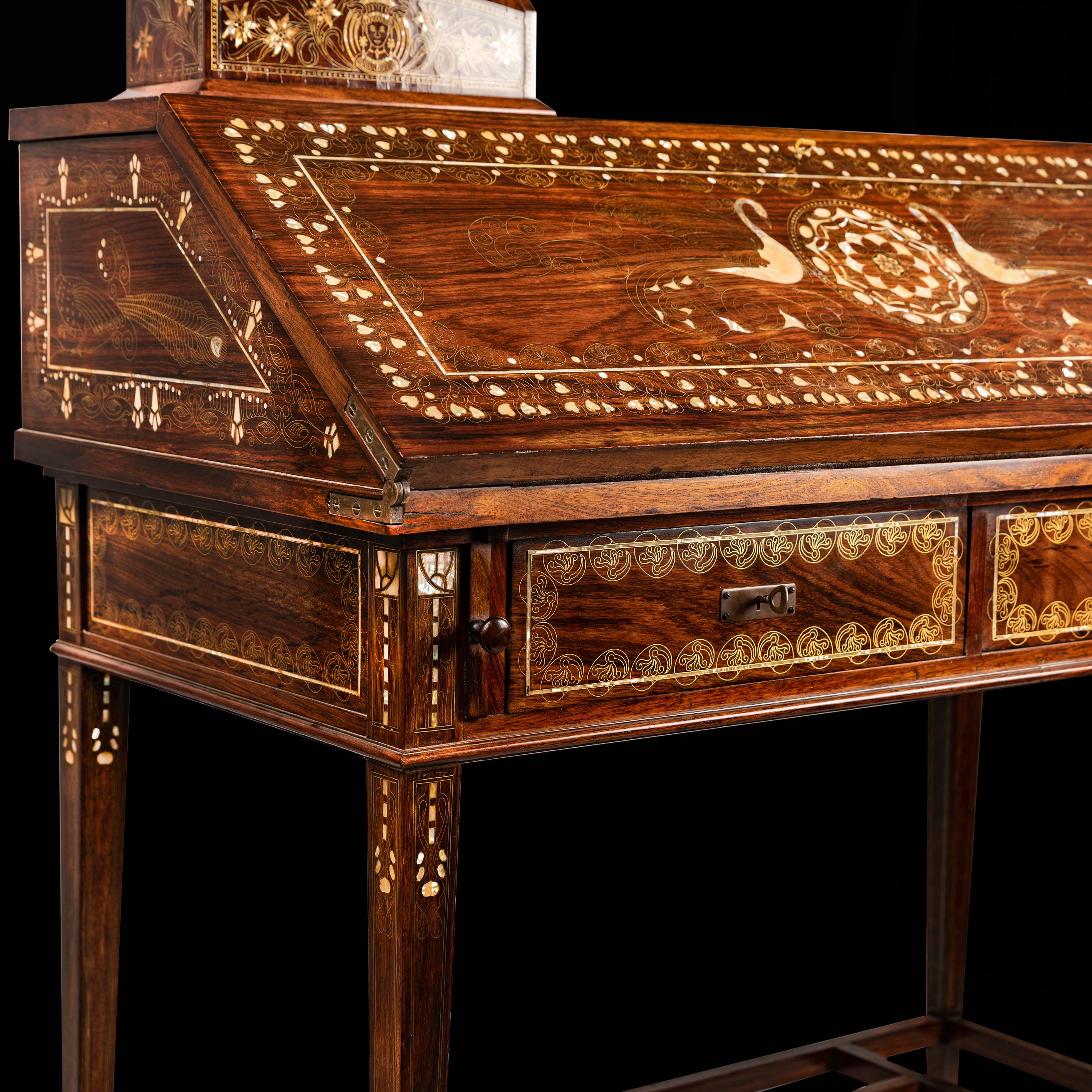 A rare complete writing desk suite by Eugenio Quarti, a leading figure of Milan’s Liberty style in the early 20th century. The slant-front secrétaire, matching side chair and wastebasket showcase Quarti’s signature metal-wire marquetry with