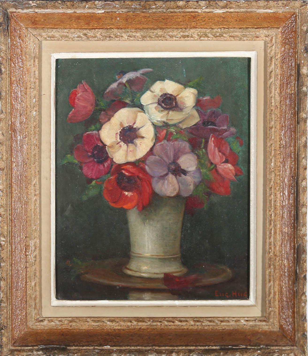 A very fine Mid Century French School still life, showing a delicate posy of vibrant anemones in a white porcelain vase. The artist has enhanced the colours of the flowers by setting them against a deep and rich green background. A petal and leaf