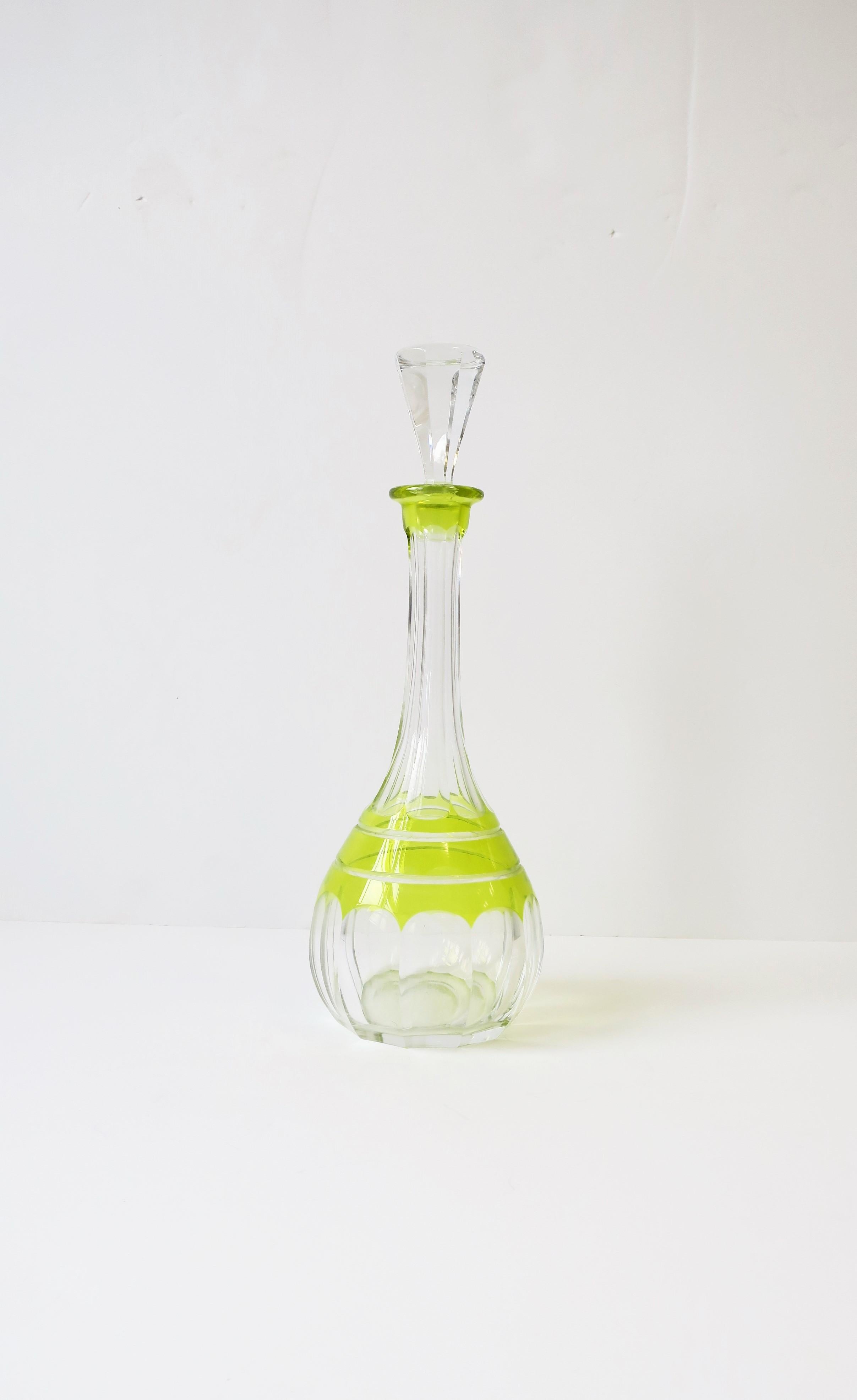 A very beautiful and rare European Czech Bohemian crystal liquor or spirits decanter, circa Mid-20th century, Czechoslovakia. Decanter is a brightly colored yellow/chartreuse with 'cut-to-clear' cut-crystal detail. This Bohemian crystal liquor or