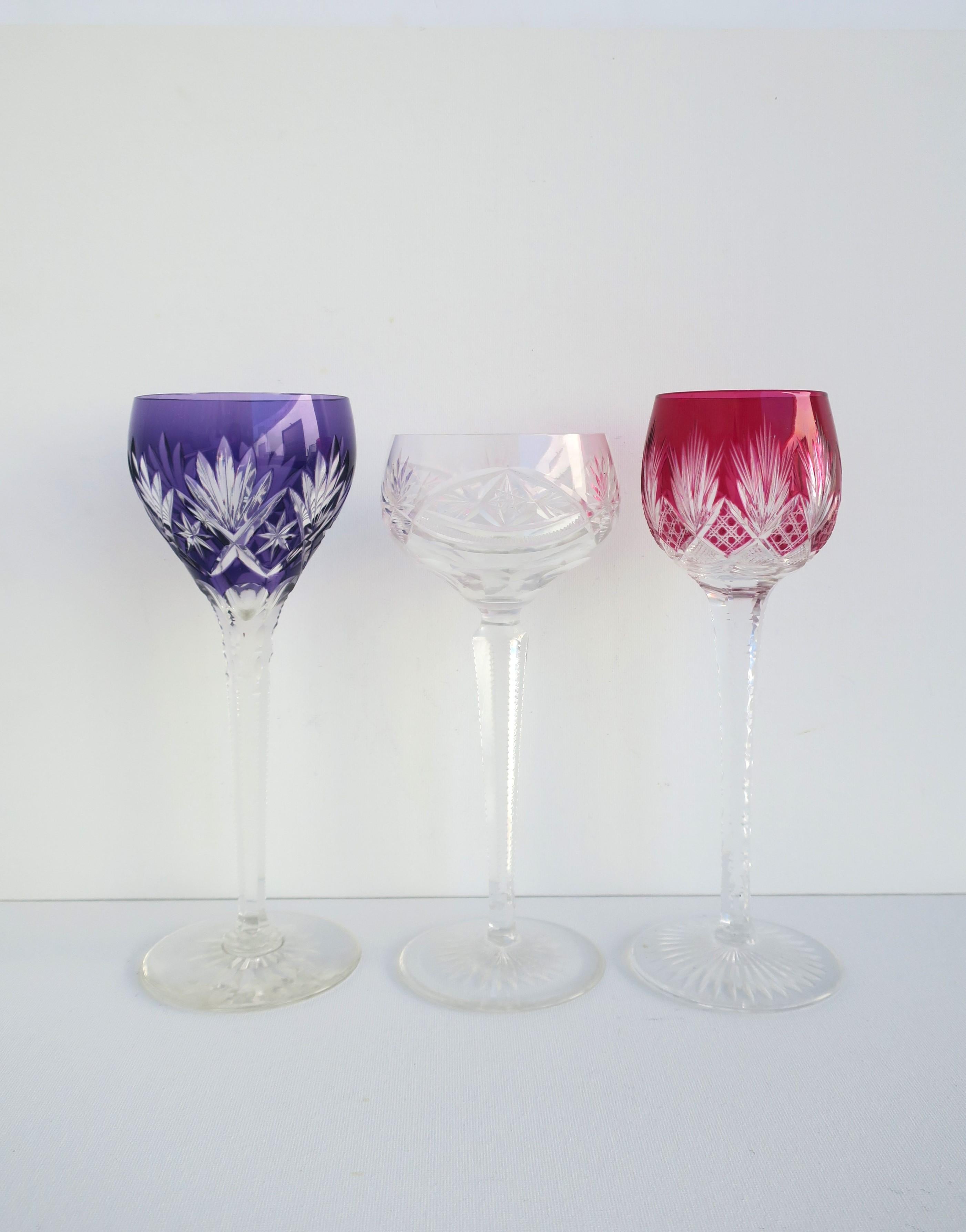 A beautiful set of three (3) colored 'cut -to-clear' Bohemian crystal cocktail glassware stemware in the style of luxury makers, Val St Lambert, Baccarat, and Saint-Louise, circa mid-20th century, 1960s, Europe, Czechoslovakia. Each glass is unique
