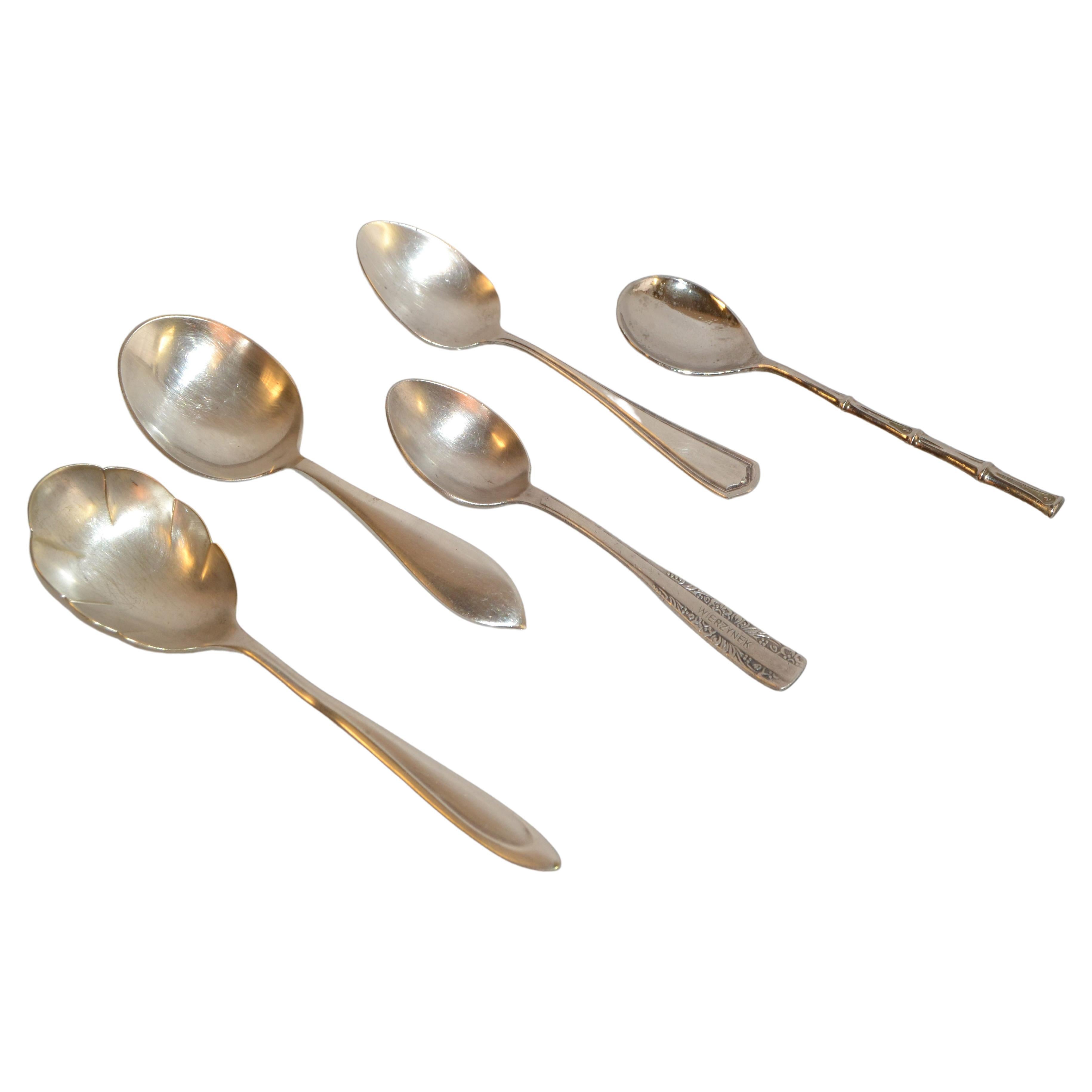 Marvelous Set of 5 Teaspoons or Baby Spoons collected during my Travel Years through Europe and the United States. All Spoons are marked and four are Silver Plate and one is Silver, marked Sterling.
Set is consisting of first the oldest Sugar