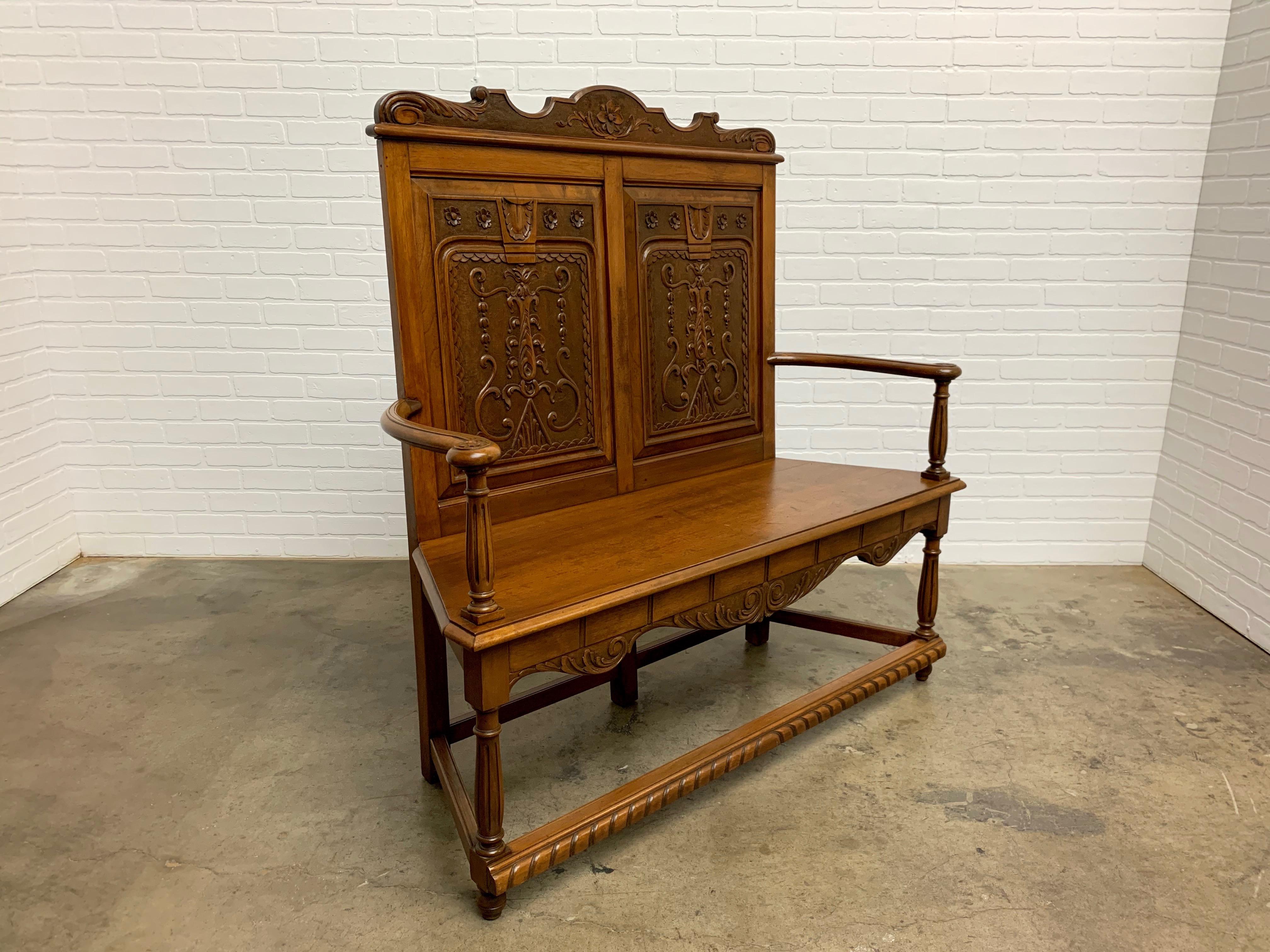 Solid Italian fruitwood and hand carved settle with fluted legs.