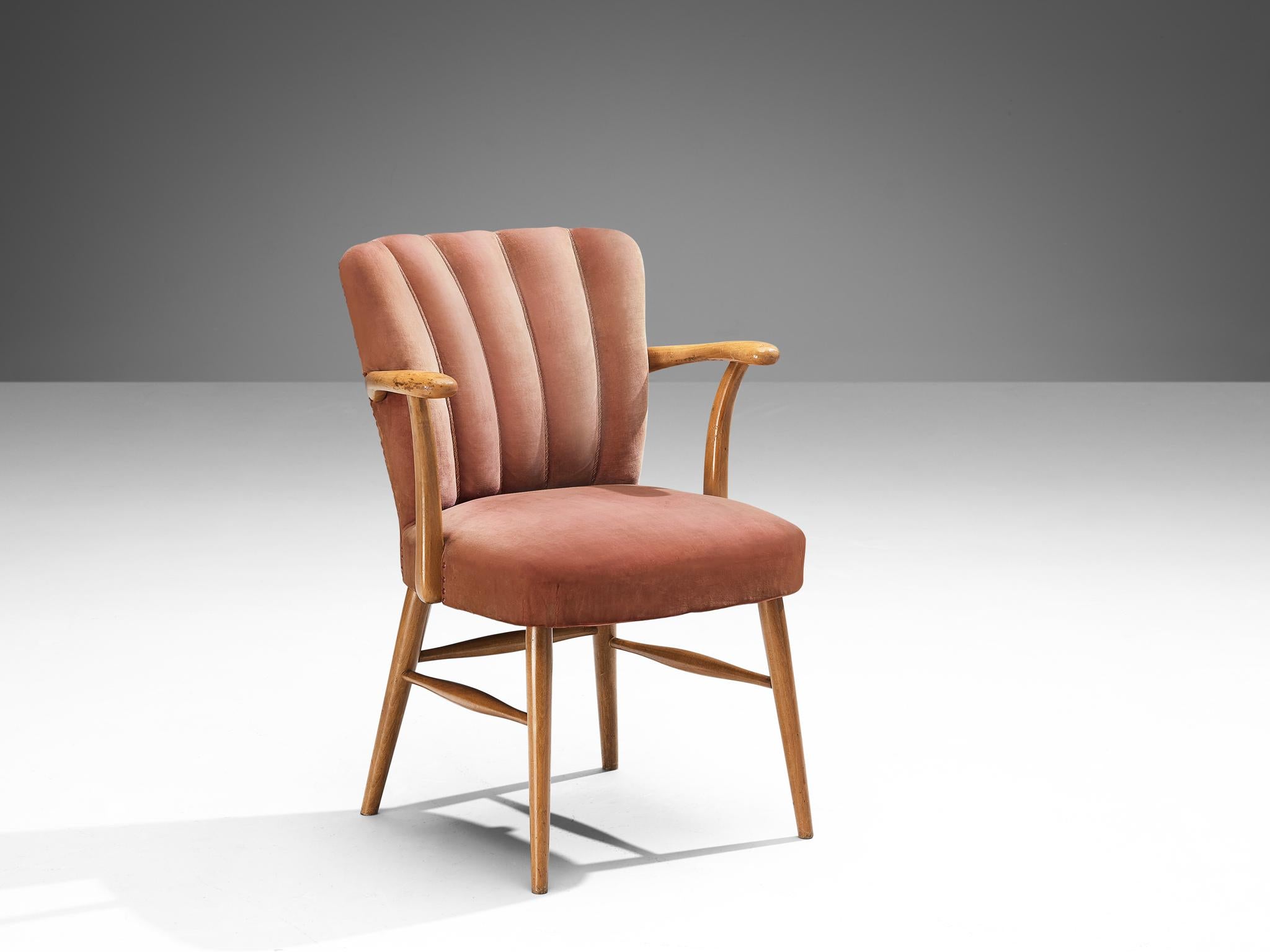 Armchair, velvet, beech, brass, Europe, 1950s

Elegant armchair in a soft pink velvet upholstery. A beech frame with armrests holds the seat and backrest that is highlighted with vertical lines ending in soft curves on top. The tufted lines