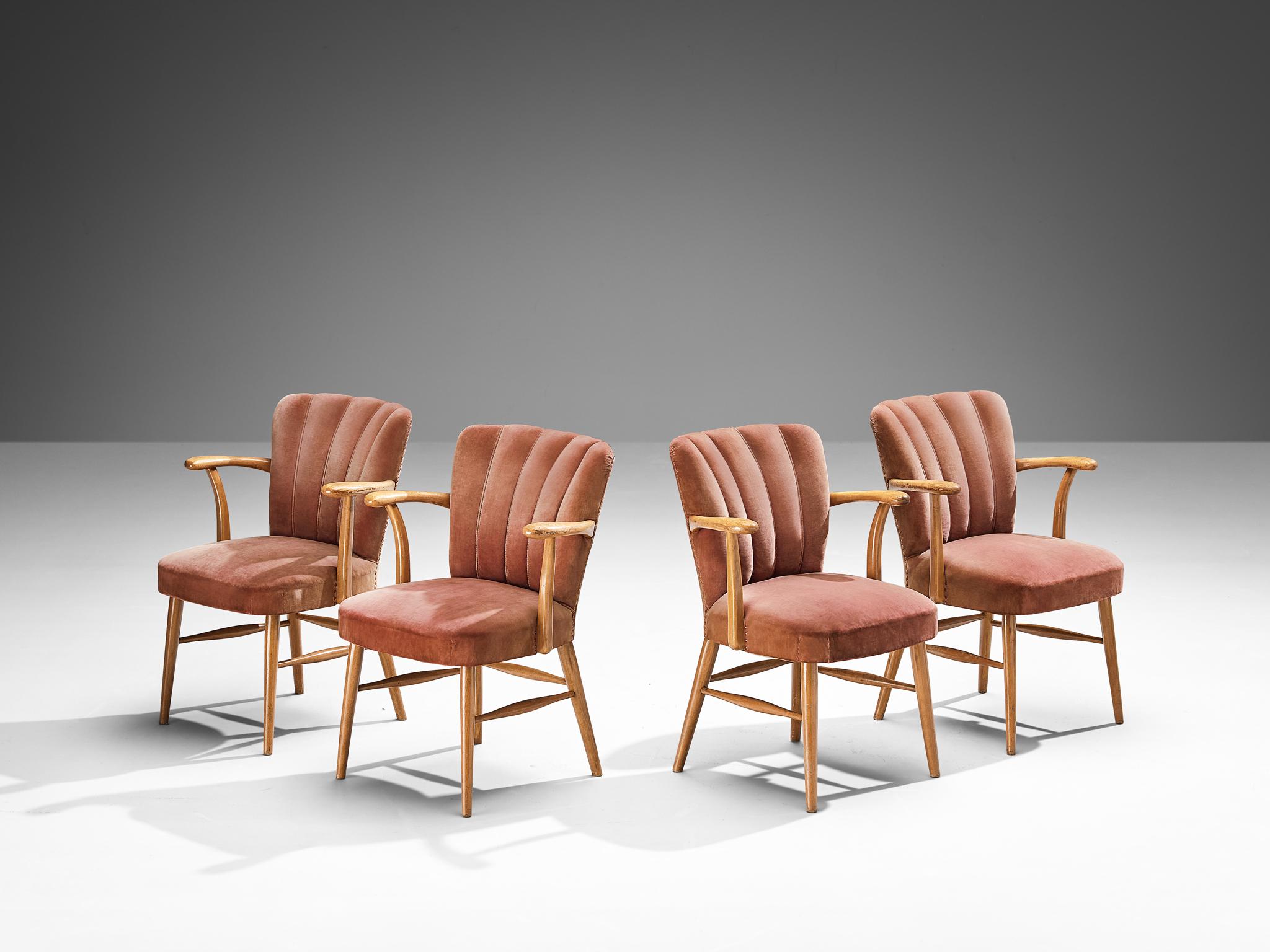 Armchairs, velvet, beech, brass, Europe, 1950s

Elegant armchairs in a soft pink velvet upholstery. A beech frame with armrests holds the seat and backrest that is highlighted with vertical lines ending in soft curves on top. The tufted lines