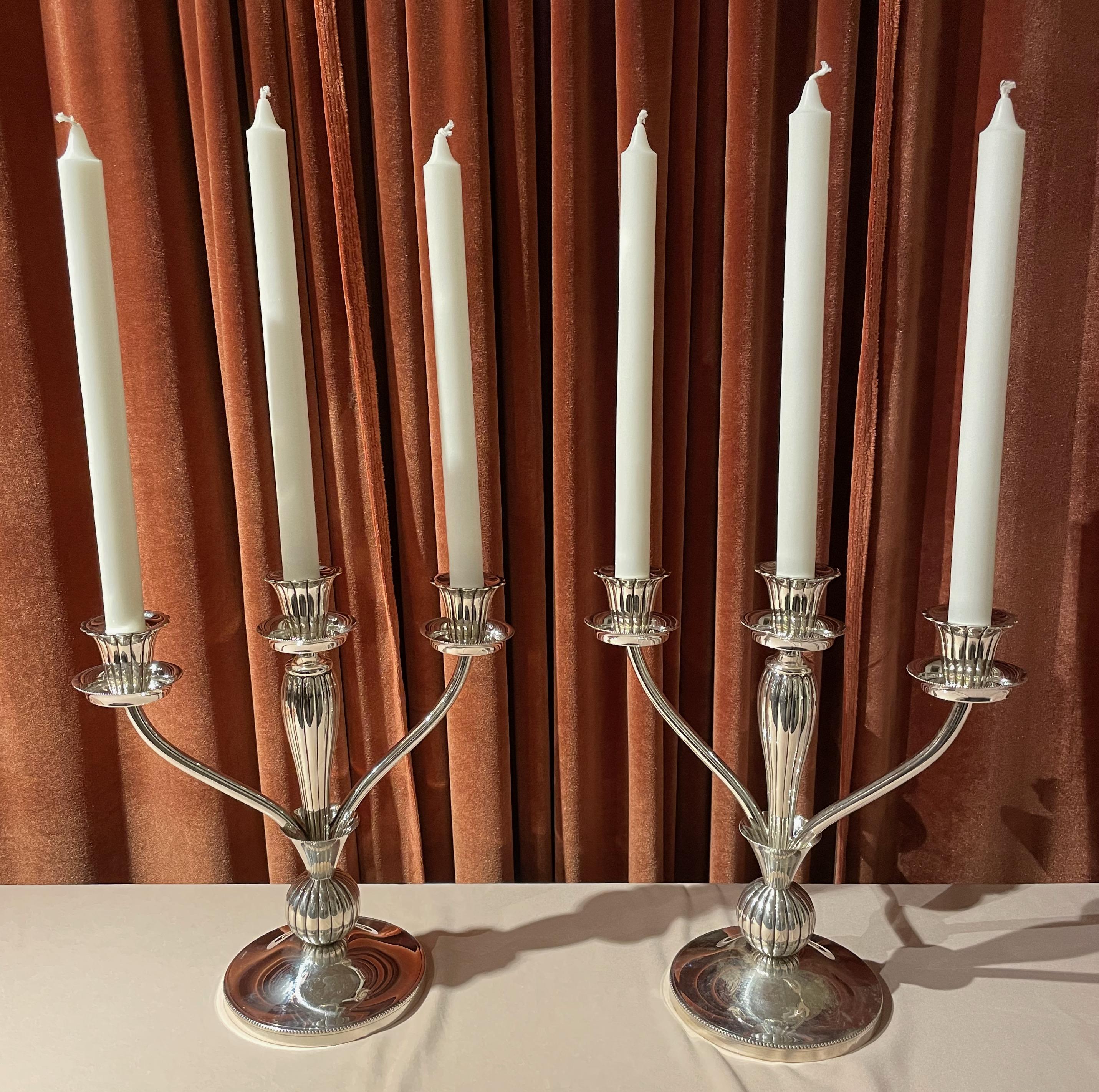 European Art Deco 925 silver pair of candlesticks Formal style with tremendous details, each piece stamped with fleur de leis and the 925 symbols. Quality construction that allows you to remove any of the wax pans for cleaning as well as the