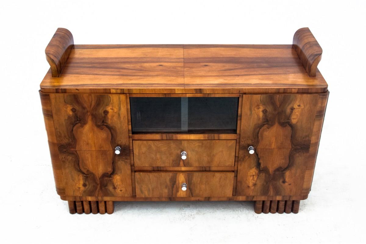 Art Deco chest of drawers made of walnut wood 
Produced in Europe, probably in Germany in circa 1940s.
After wood renovation, polished 
Dimensions: height 72 cm / width 112 cm / depth 45 cm
