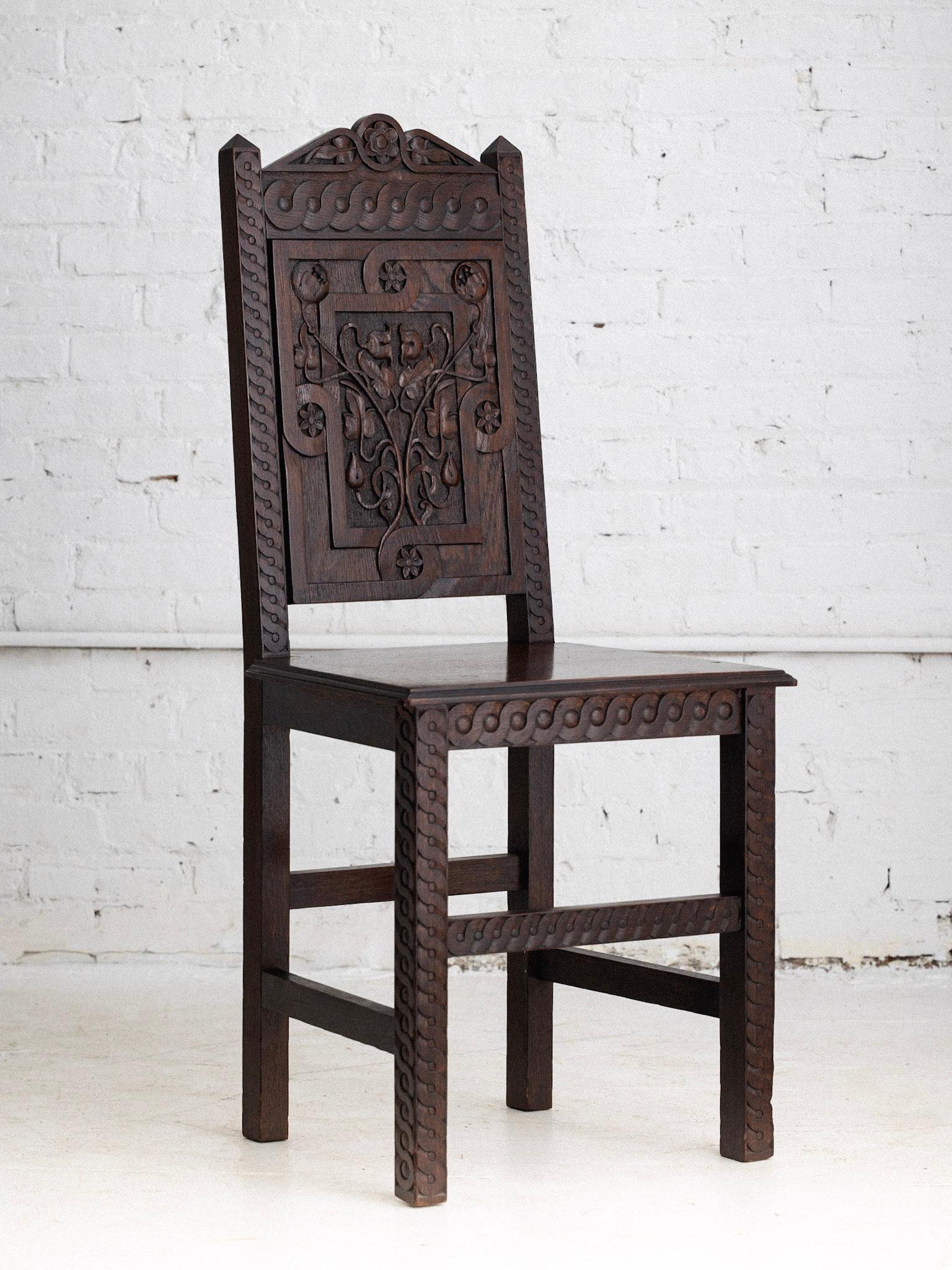 An early 20th century carved oak chair. Art Nouveau motif, possibly Austrian or Italian. Provenance unknown.