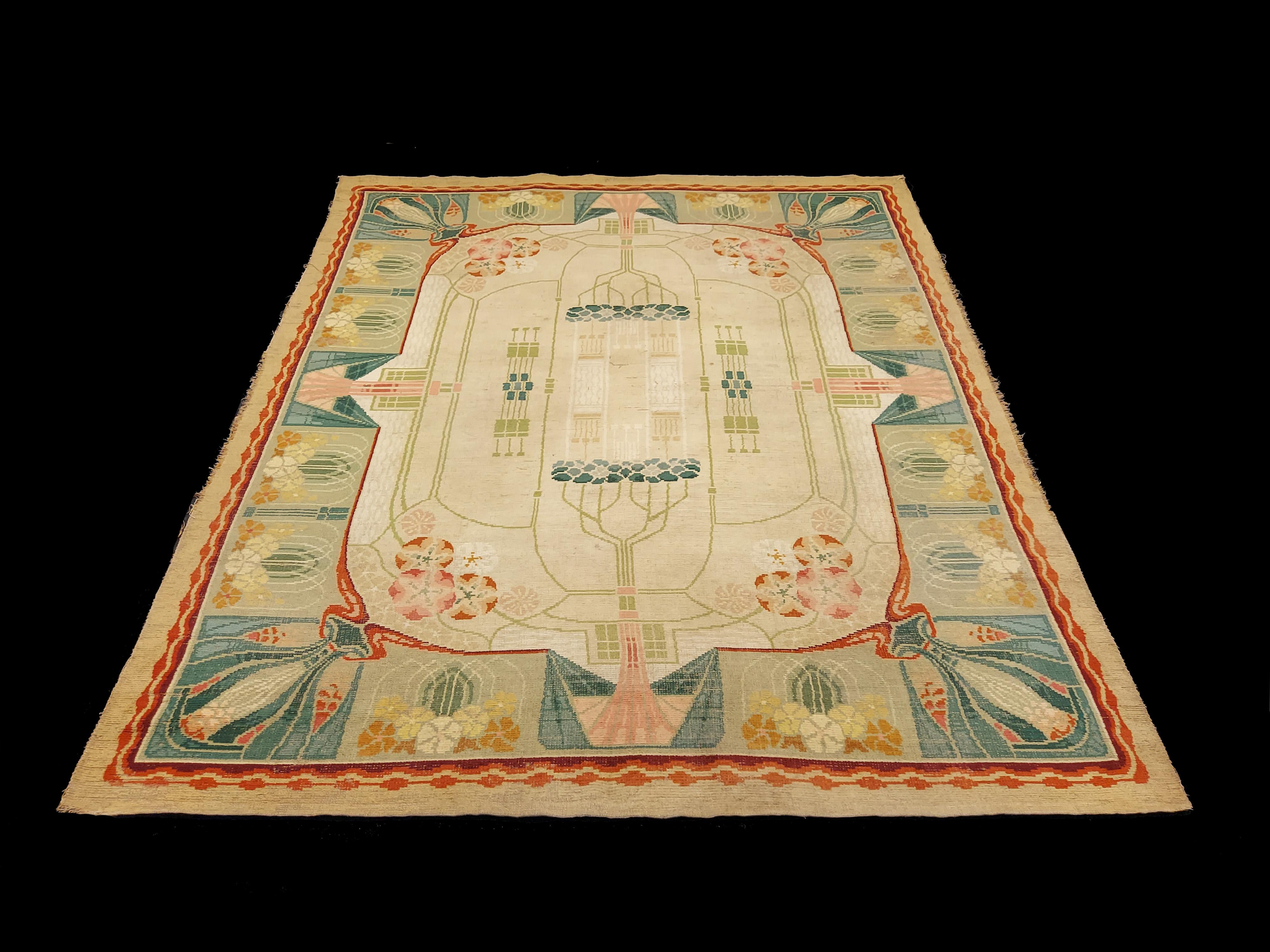 An exceptional and rare European handwoven Art Nouveau rug, in fine wool and perfect condition, dated circa late 19th century (circa 1890), attributed to famed designer Gustave Serrurier-Bovy. With typical art nouveau floral and architectural motifs