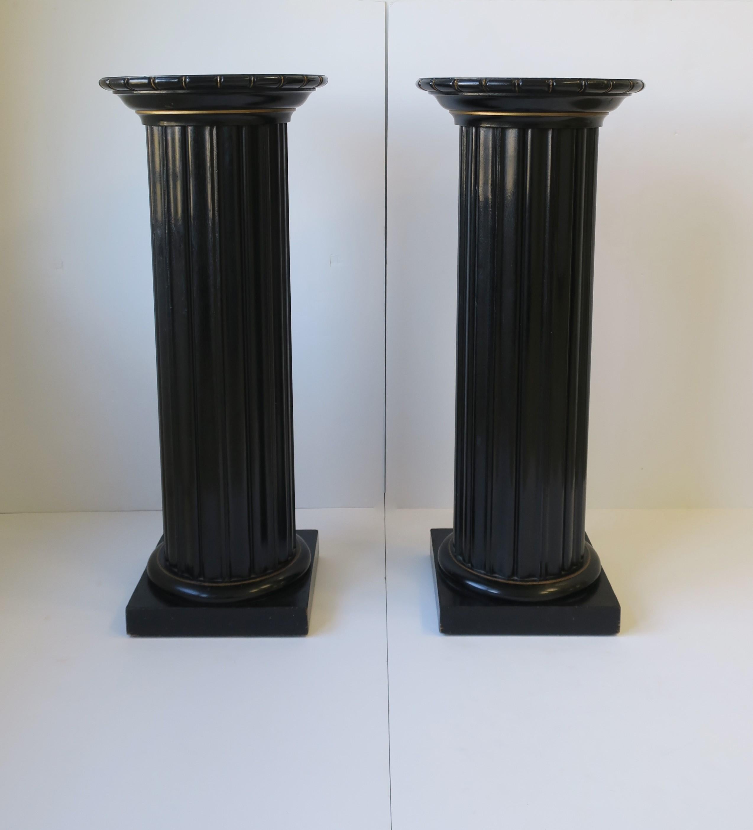 One available, as per listing. 

Beautiful European black lacquer, with touches of gold, fluted wood pillar column pedestal stand in the Neoclassical design style, circa mid-20th century, Europe. Pedestal is black lacquer with touches of gold