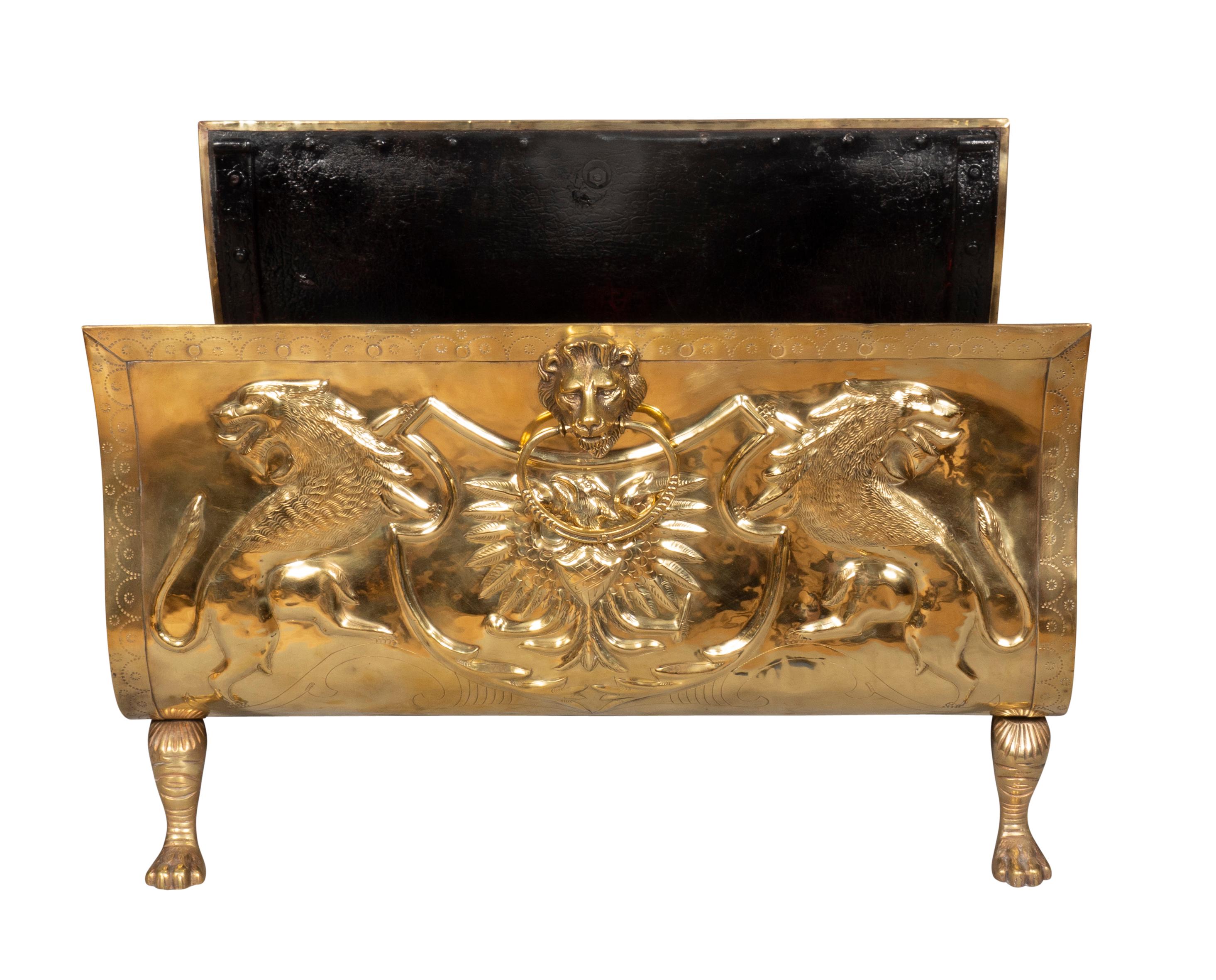 Heavy gauge with lion and loins head decoration with an eagle, Black painted interior, brass feet. Polished.